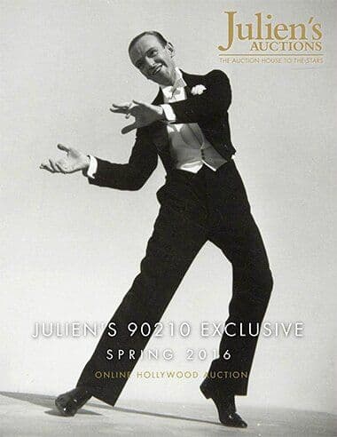 A man in a tuxedo is on a poster for Julien's Auctions