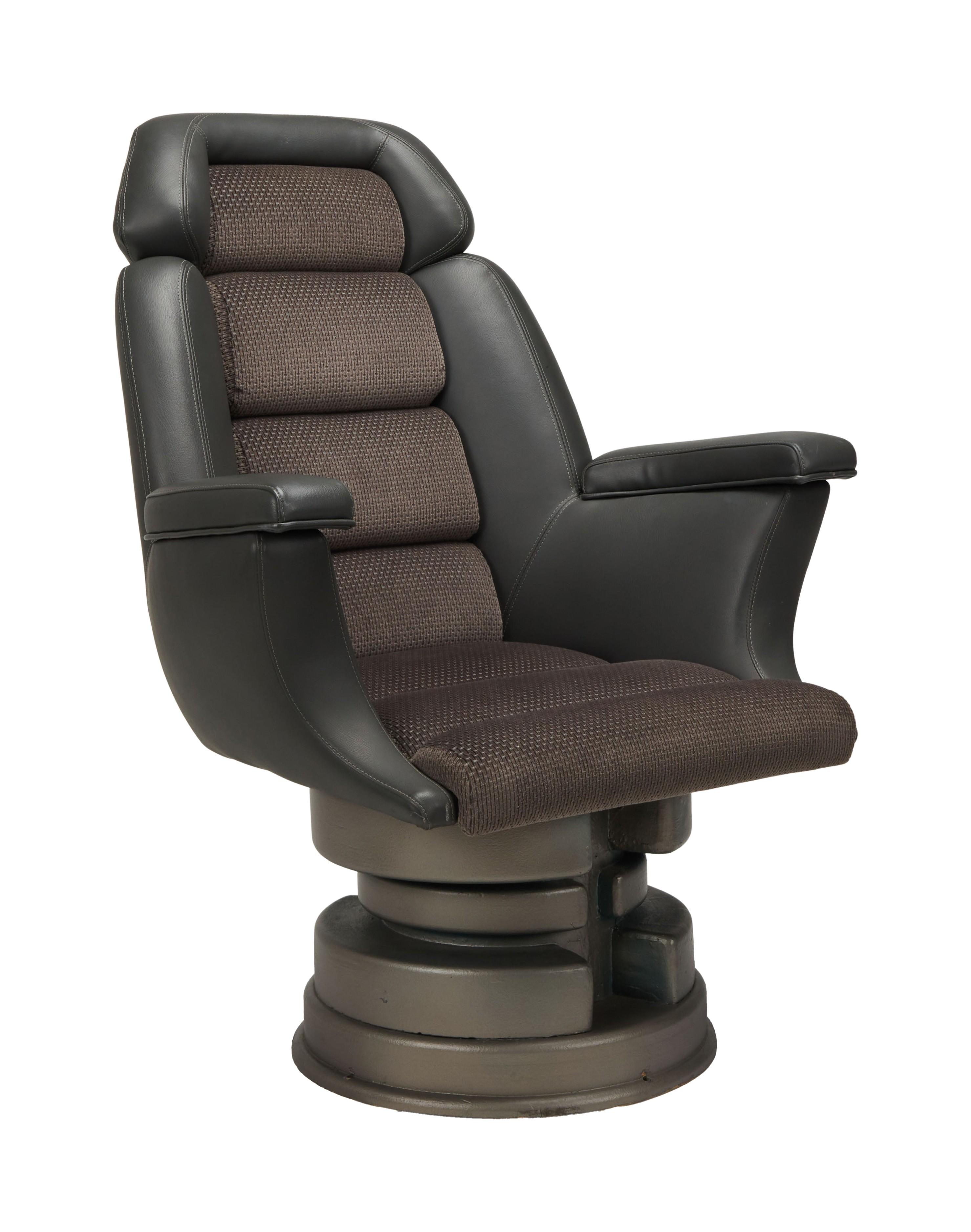 a black leather chair with a brown cushion on a white background