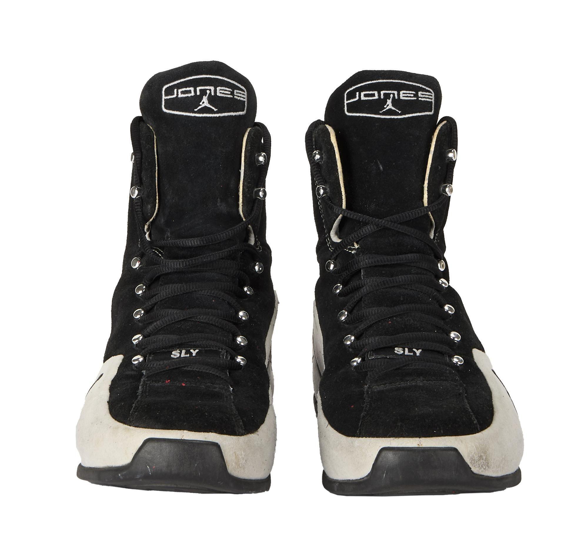a pair of black and white jordan brand roy jones junior boxing shoes