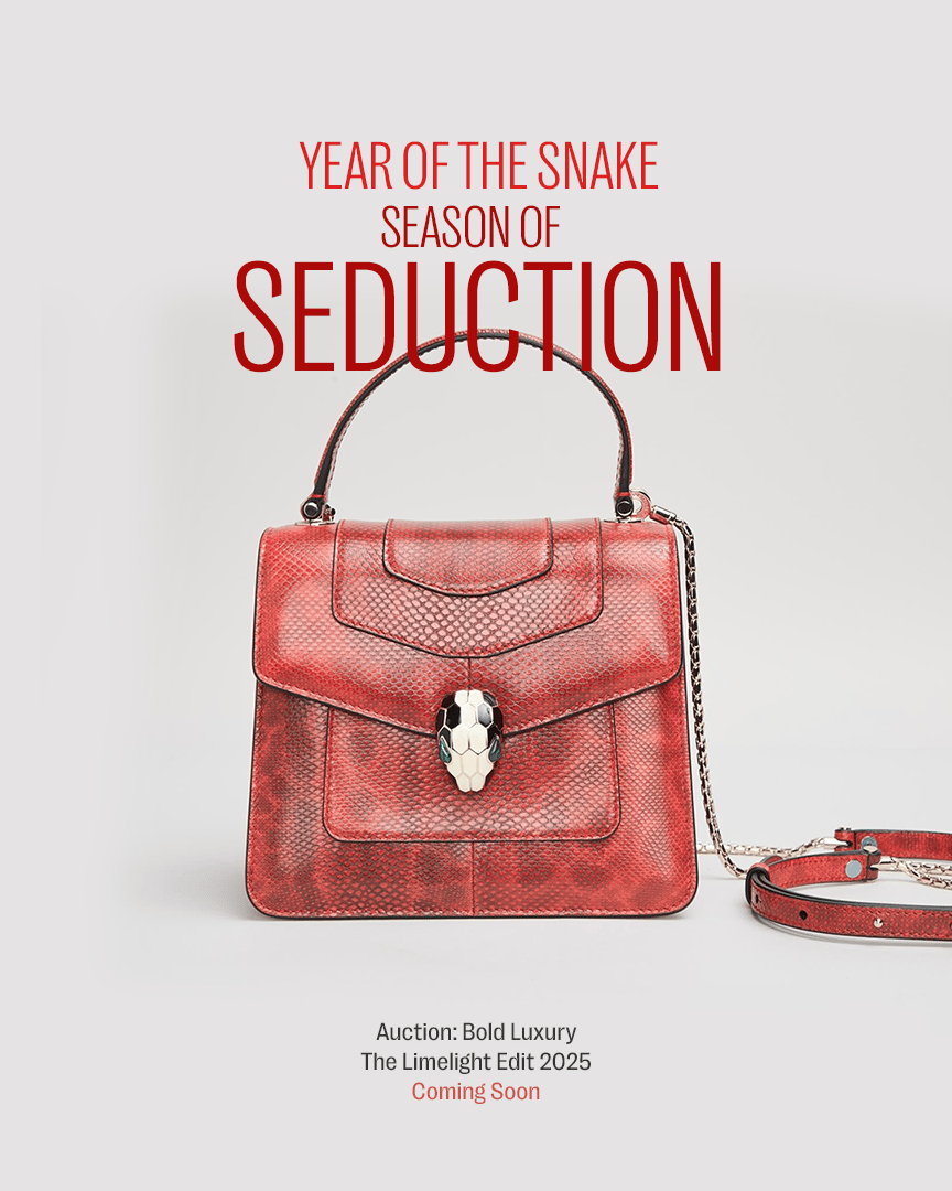 a red purse with the words year of the snake season of seduction above it