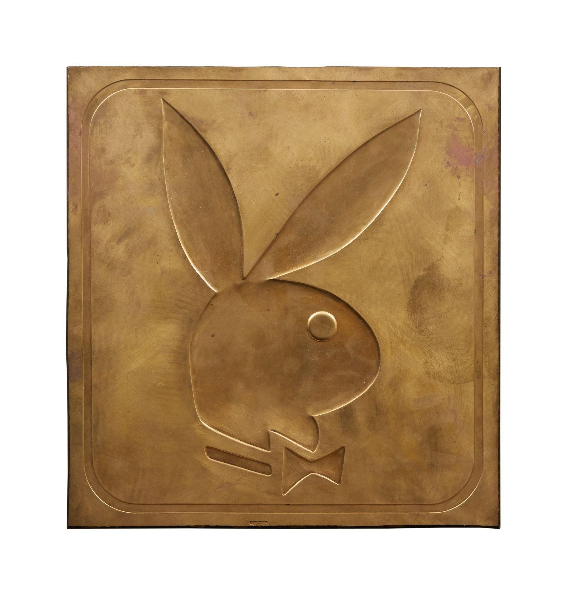a brass plaque with a playboy bunny etched into it