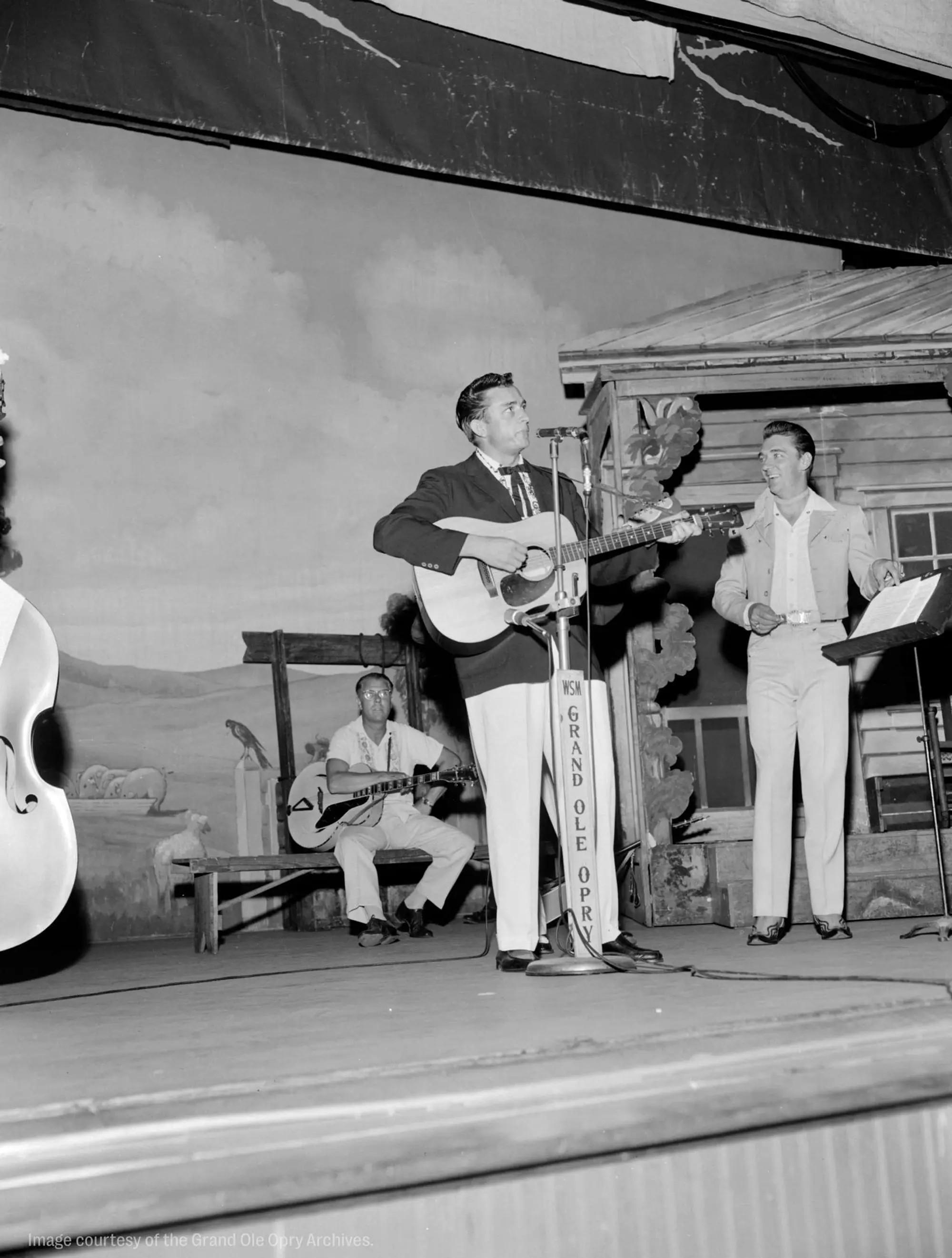 Lot #24 Johnny Cash Grand Ole Opry 1956 Debut Stage Played 1954 Martin D18 Acoustic Guitar black and white photo