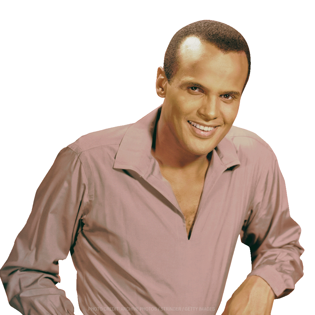 a man in a pink shirt is smiling for the camera