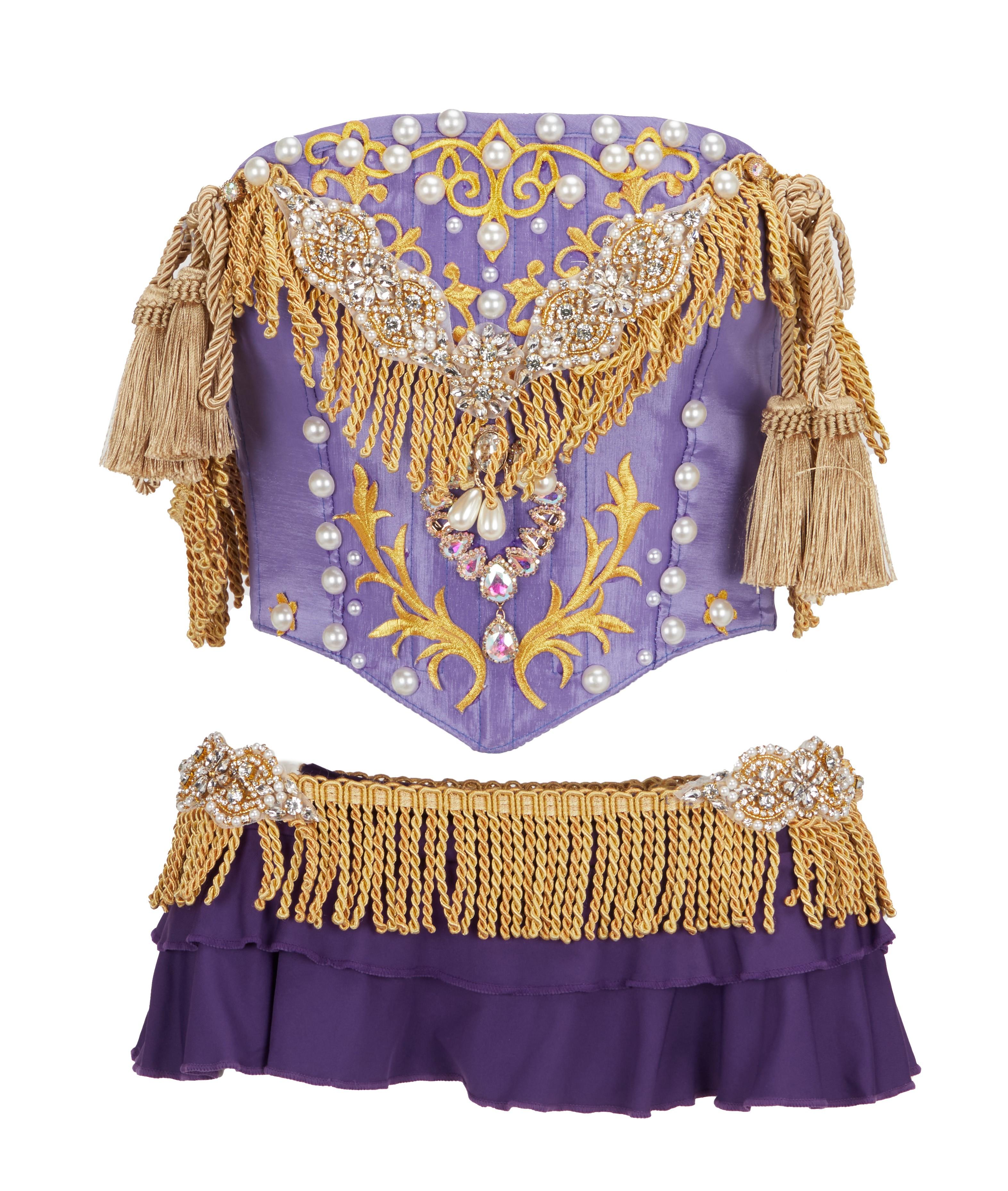 a purple corset with gold fringe and pearls
