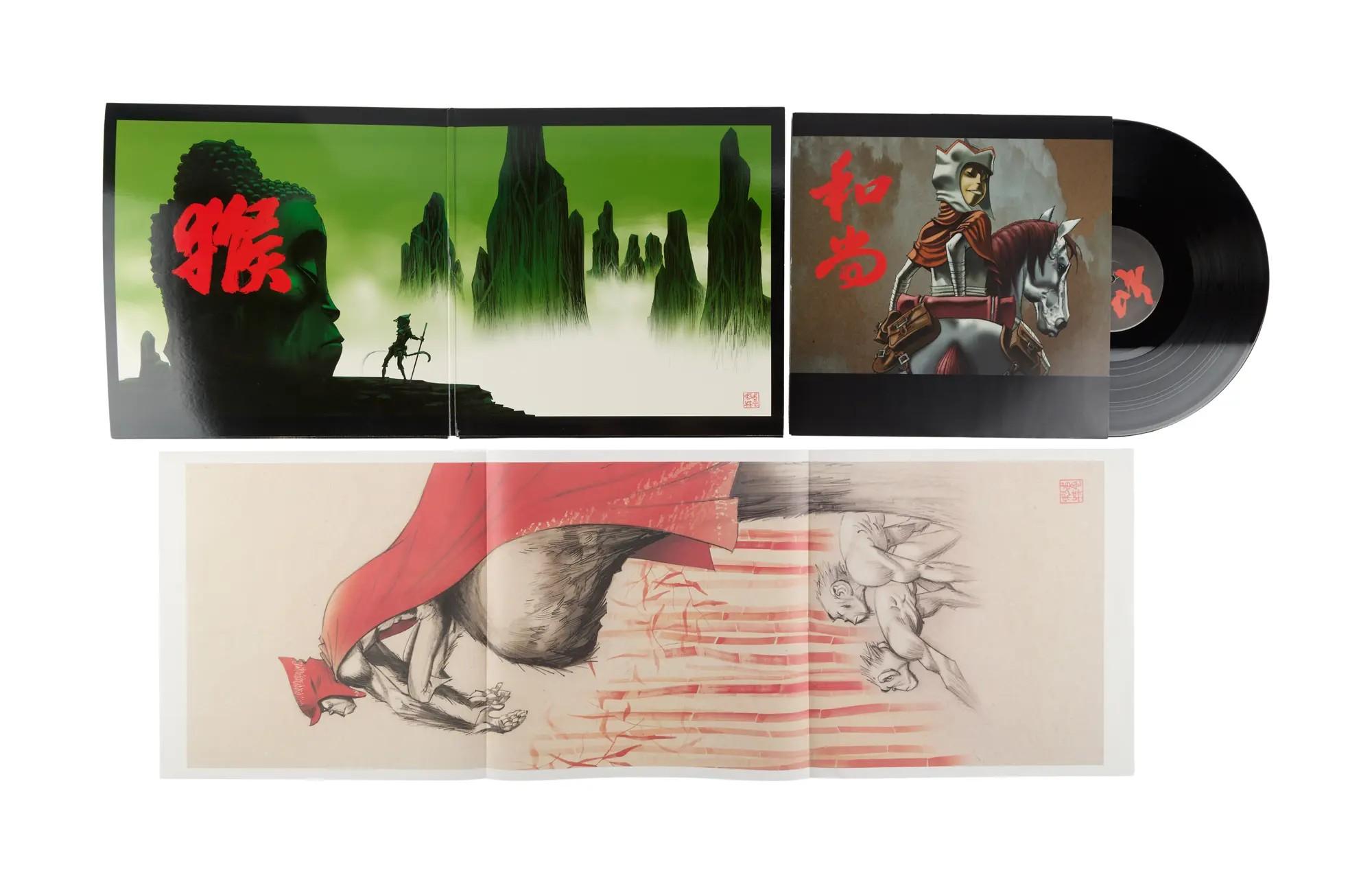 Vinyl album set with open gatefold, closed cover, black record, and unfolded art print, all displaying fantasy illustrations and red text.