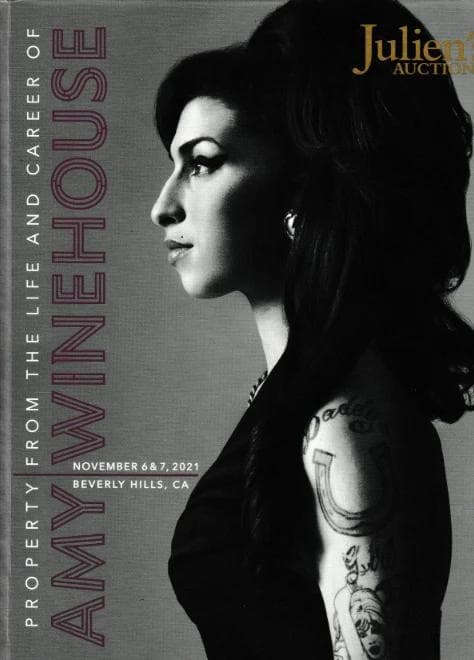 A poster for Julien's Auctions with Amy Winehouse