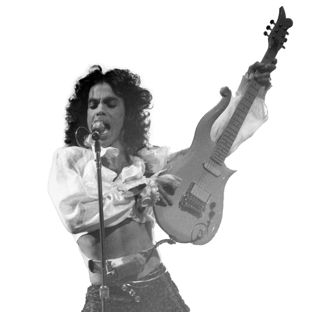 a man singing into a microphone while holding a guitar