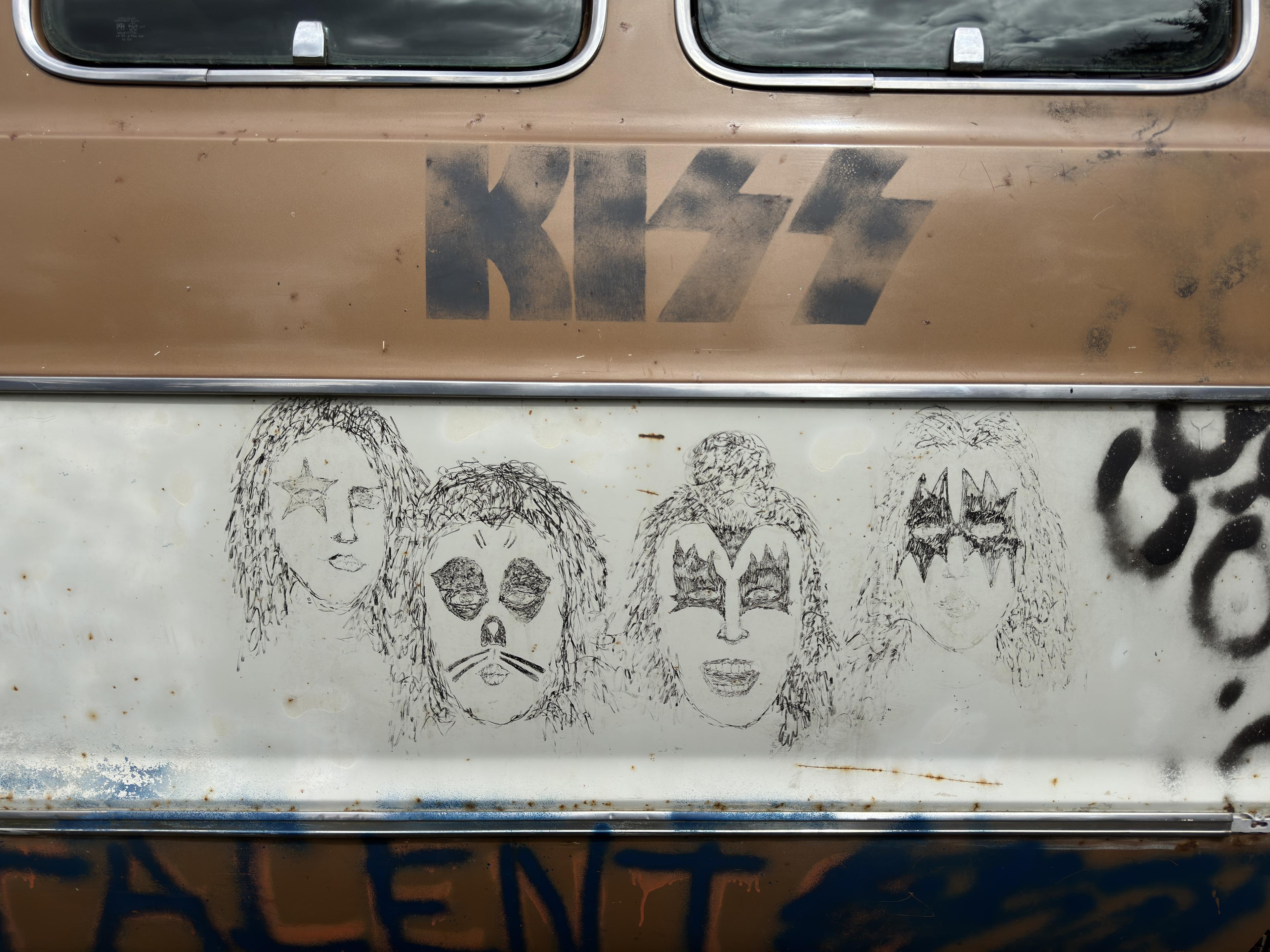 drawings of kiss band members on the side of a van