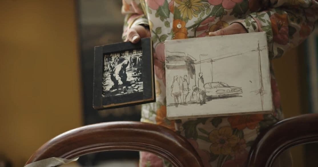 Steve Lazarides holds two original banksy artworks