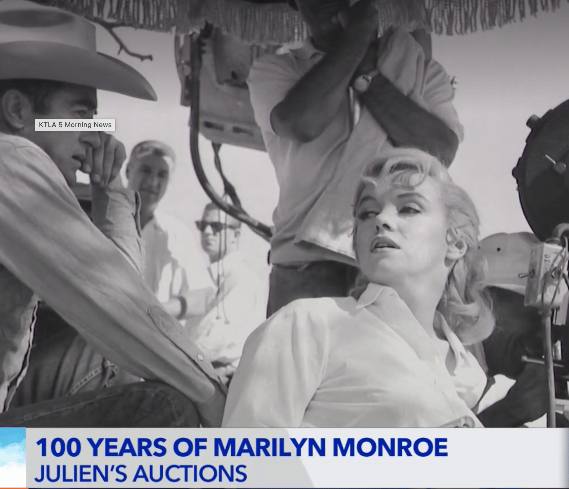 a black and white image of marilyn monroe on a film set