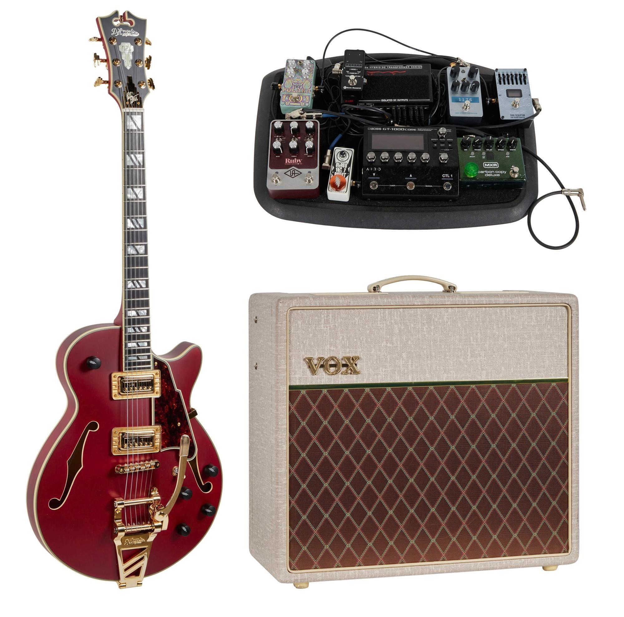 a vox guitar amplifier and a pedal board