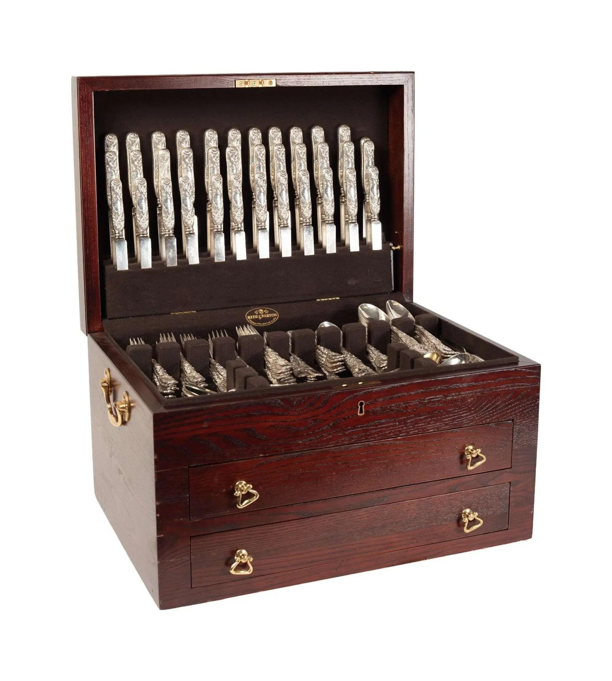 Lot #505. Whoopi Goldberg | Tiffany & Co. Chrysanthemum Pattern Sterling Flatware Service a brown wooden box with sterling flatware