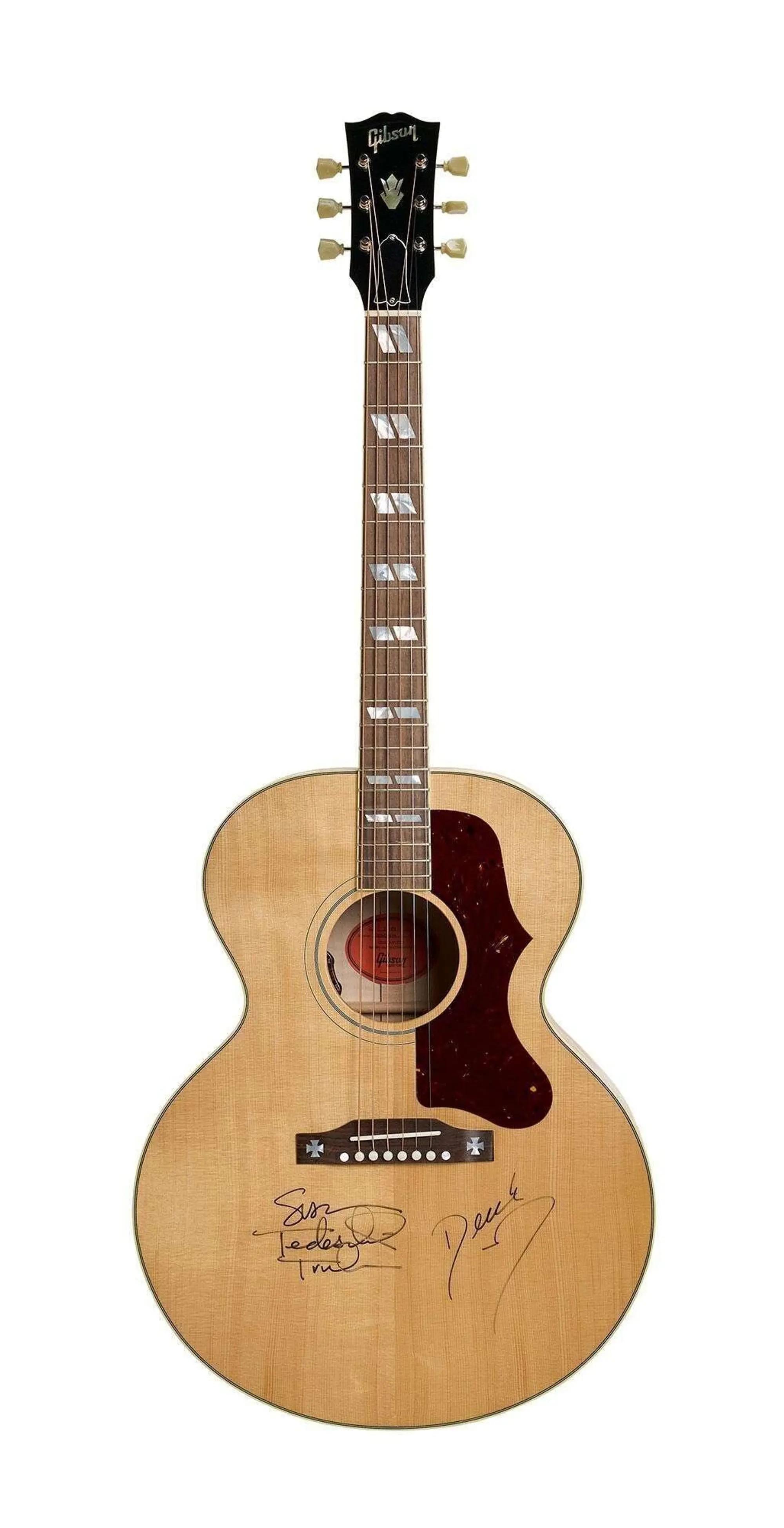 Lot #14. Tedeschi Trucks Band | Signed Gibson J-185 Original Acoustic Guitar Natural wood Gibson acoustic guitar with a dark pickguard and multiple signatures on its body.