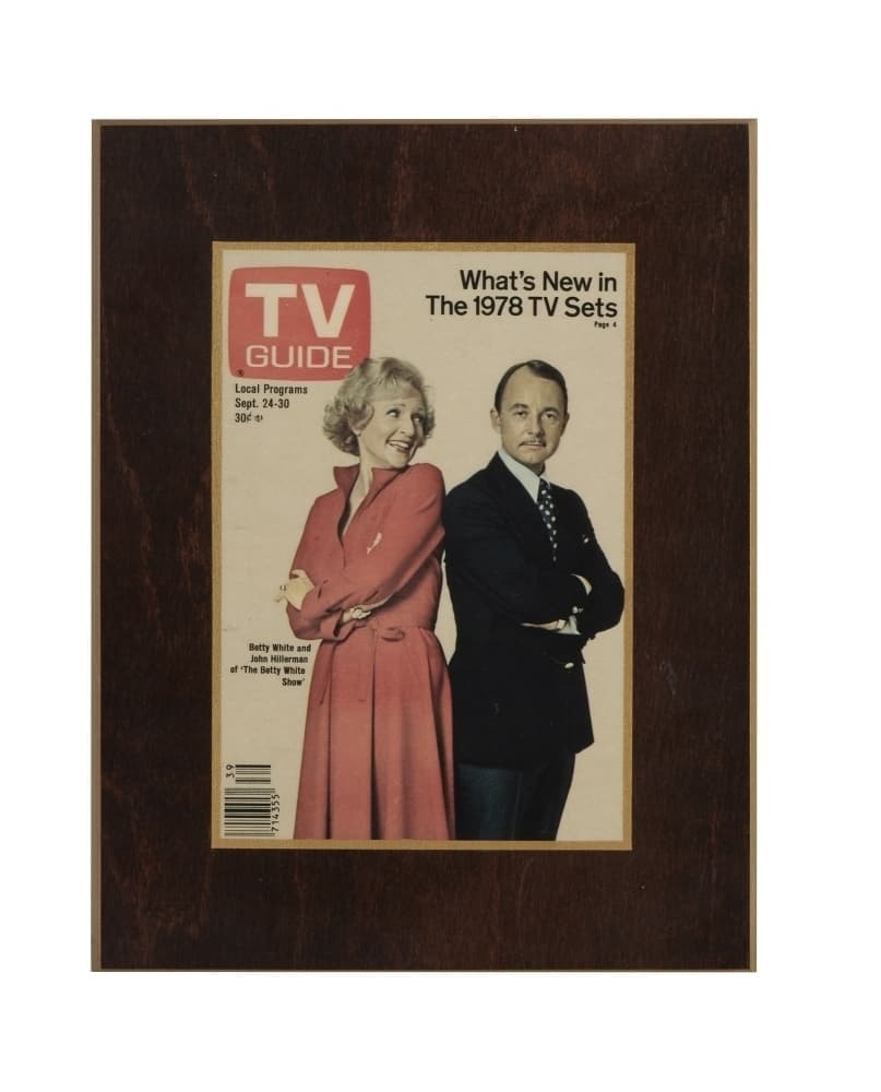 a tv guide magazine with a man and woman on the cover