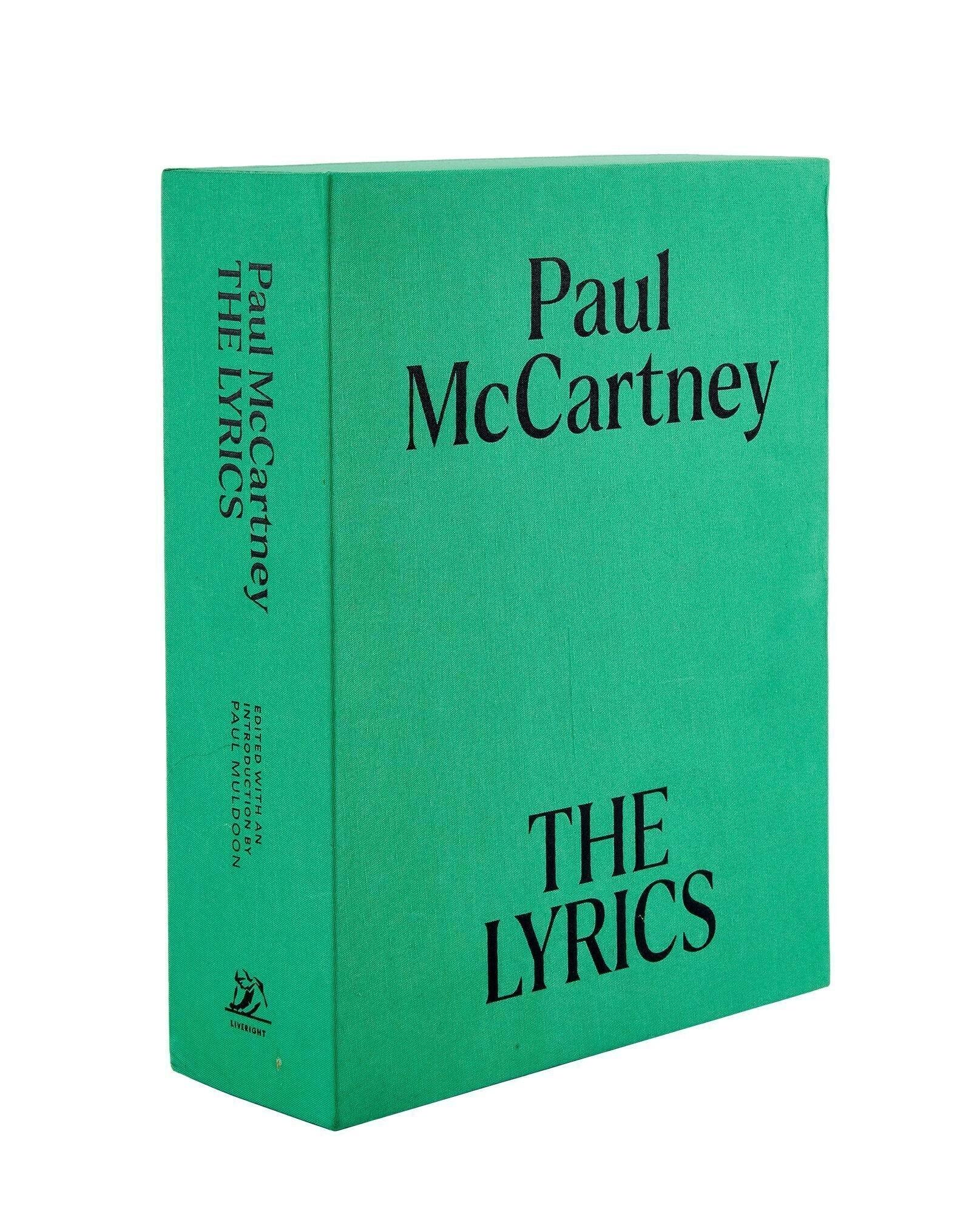 Paul McCartney | Signed Lyric Book A green book titled "Paul McCartney THE LYRICS" standing upright.