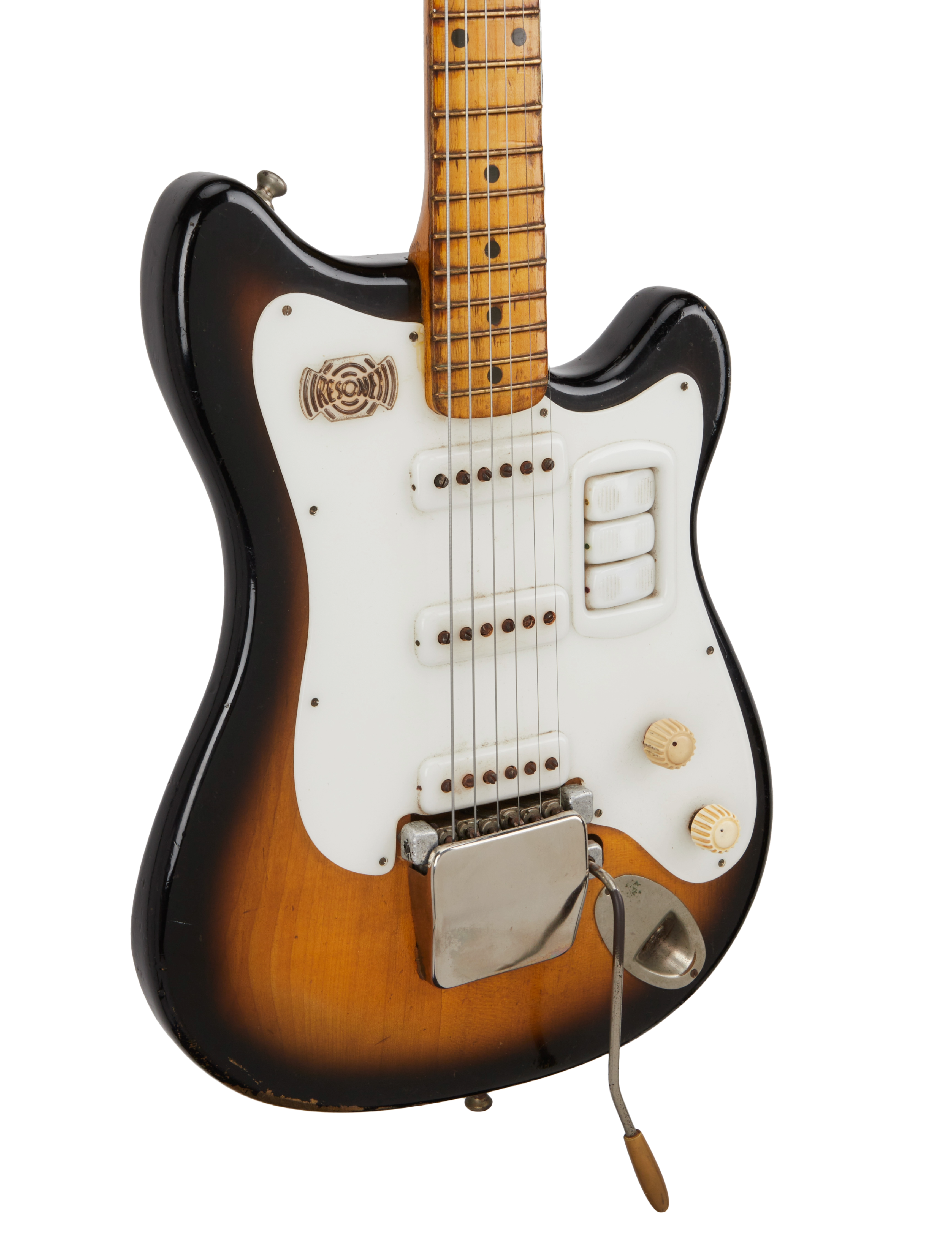 a brown and white electric guitar with a black background