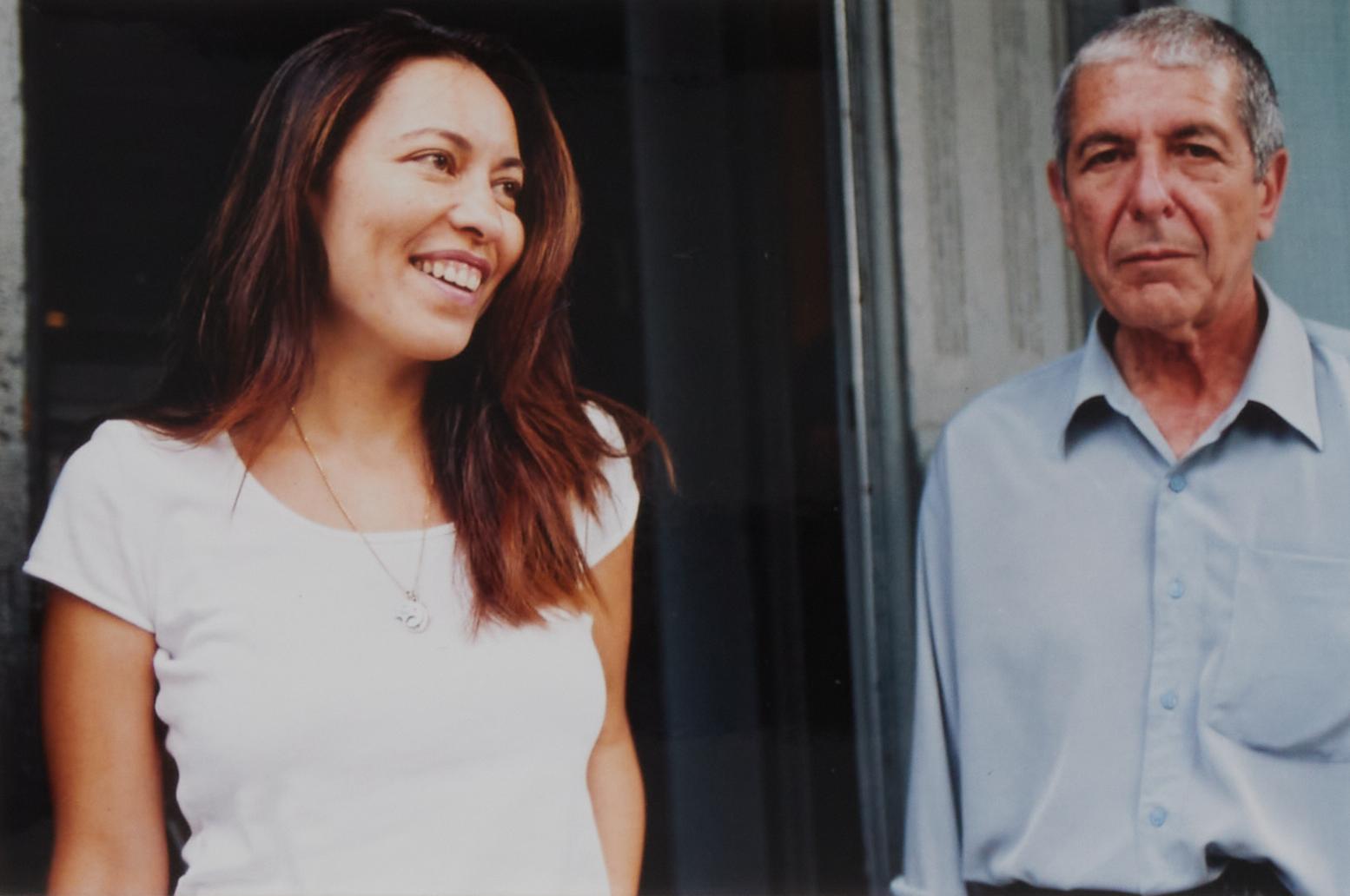 a man and a woman are standing next to each other and smiling
