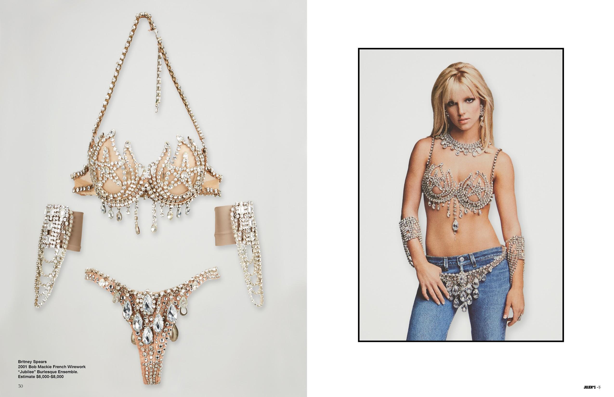 a woman is wearing a bra and thong with rhinestones .