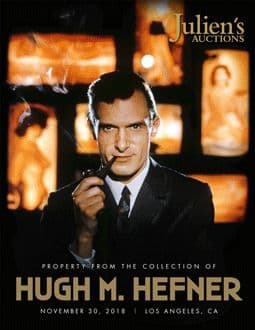 A poster for Julien's Auctions featuring Hugh Hefner