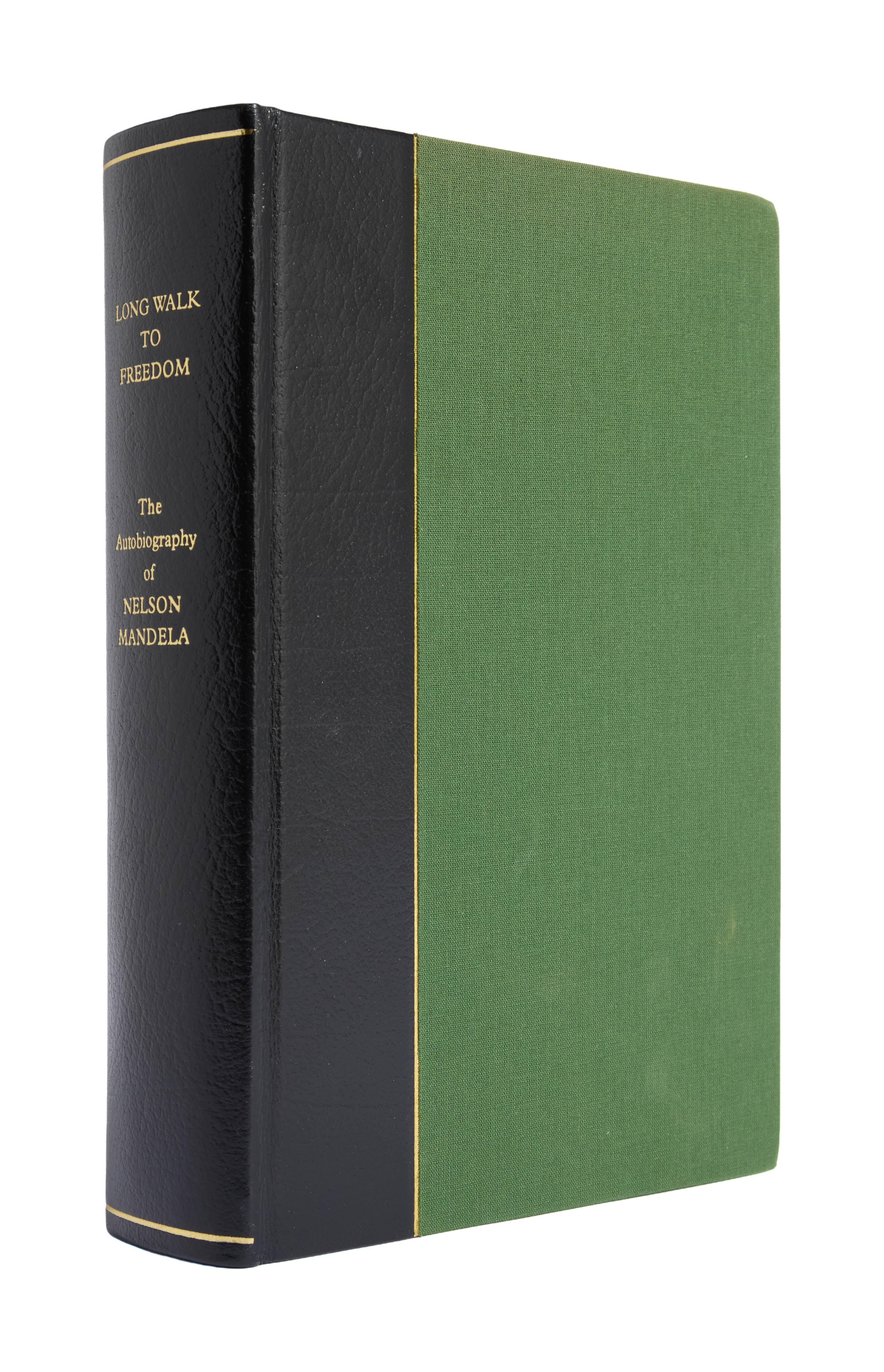 Hardcover book 'Long Walk to Freedom' by Nelson Mandela, with gold text on a black spine and a green cover.