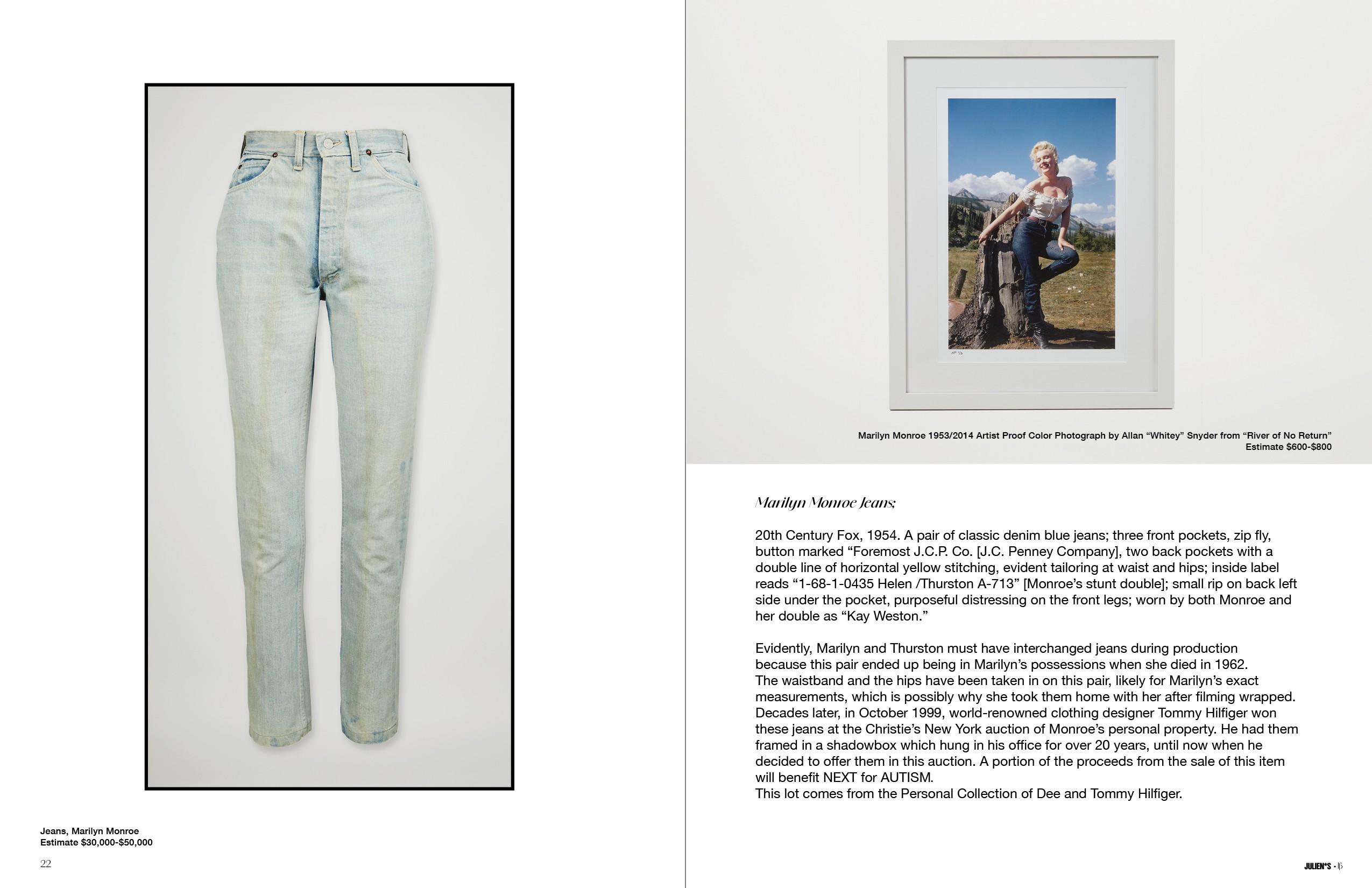 a pair of light blue jeans and a framed picture of marilyn monroe .