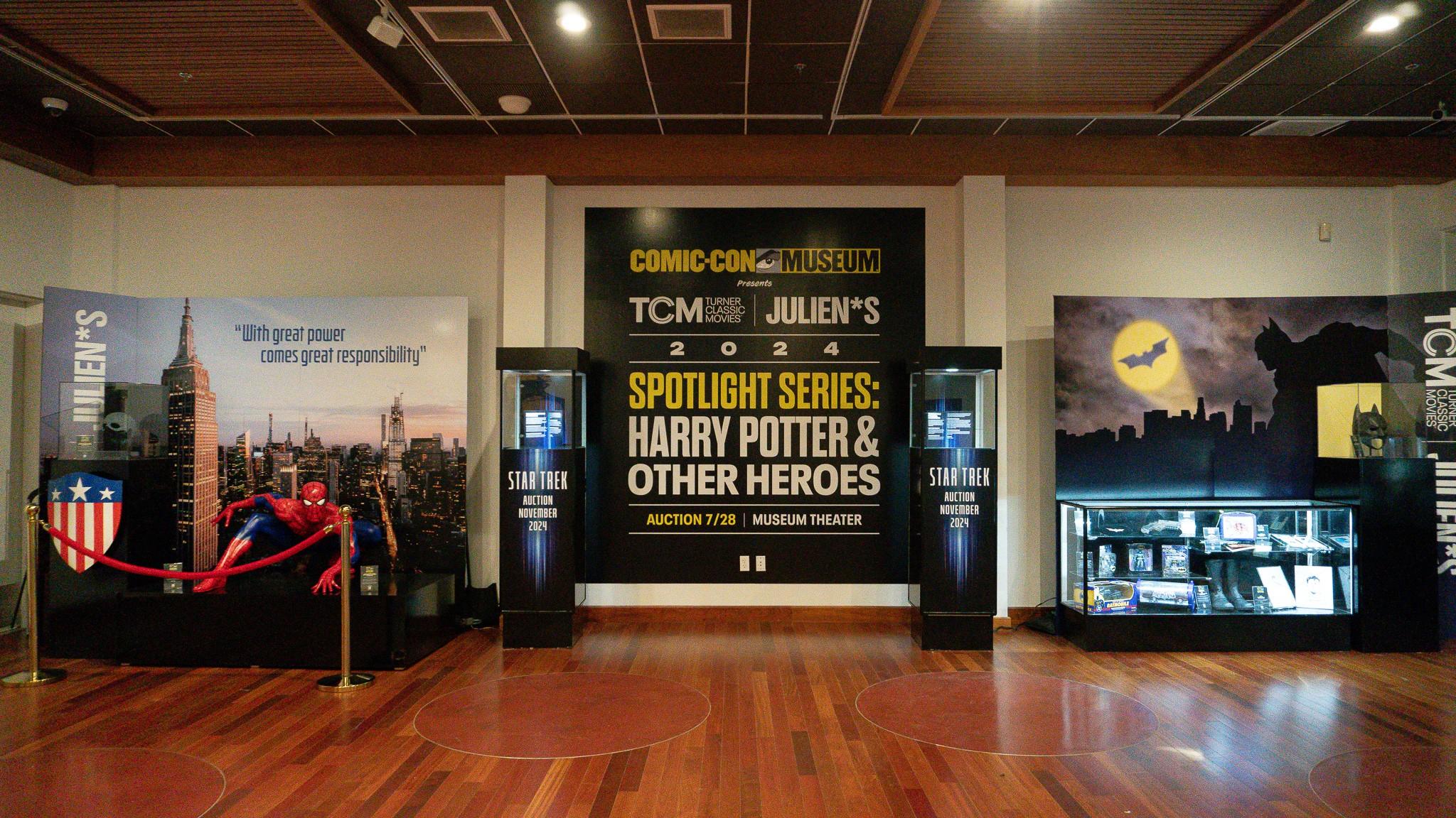 a room with a sign that says spotlight series : harry potter and other heroes .