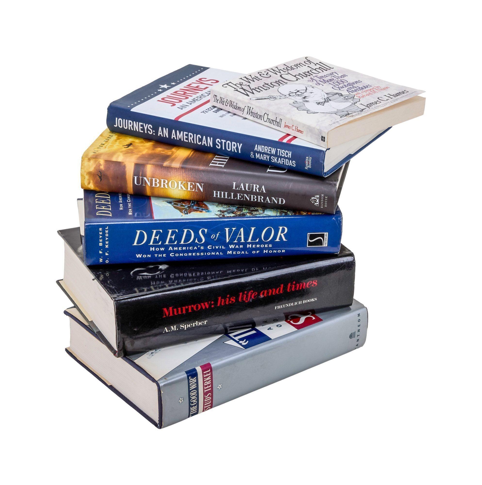 a stack of books with one titled deeds of valor