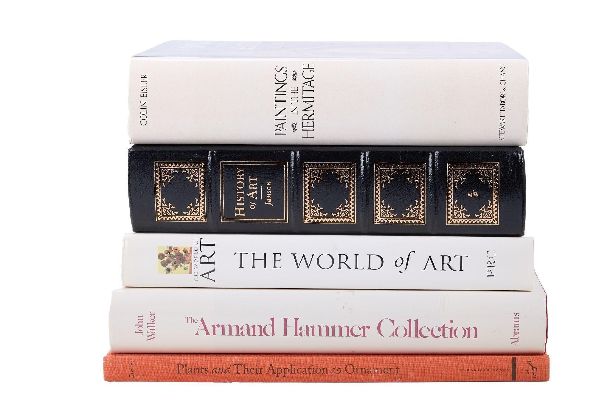 four books are stacked on top of each other on a white background .