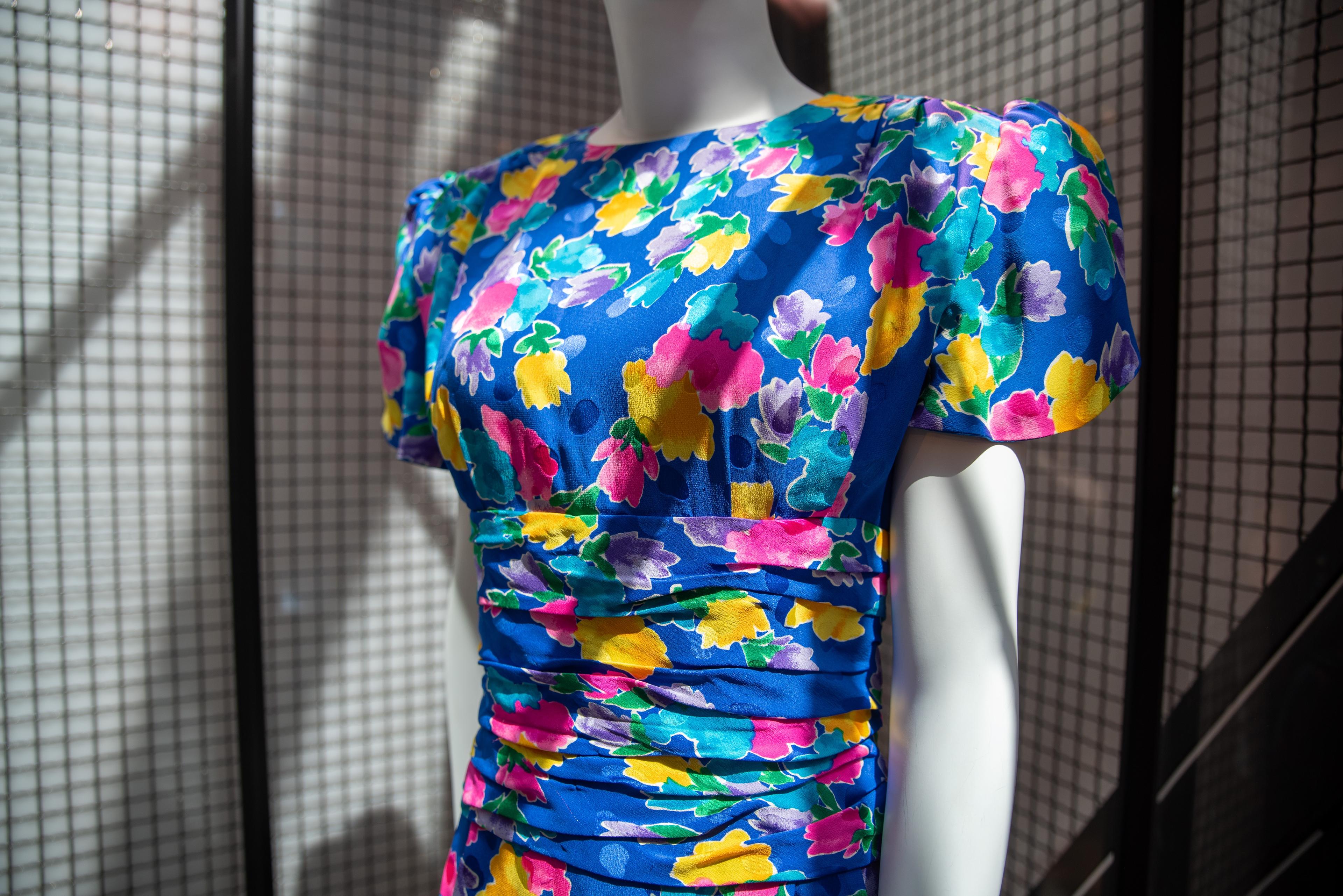a close up of a blue flower dress
