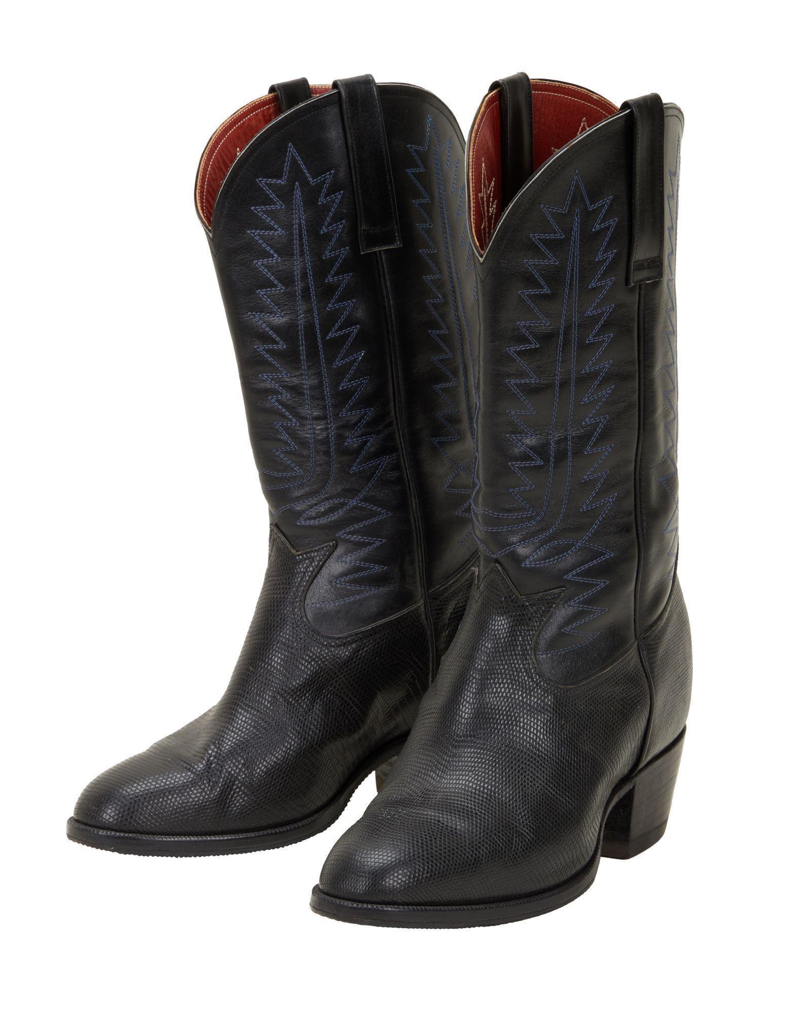 Lot #324. Burt Reynolds | Black Cowboy Boots a pair of black cowboy boots on a white background