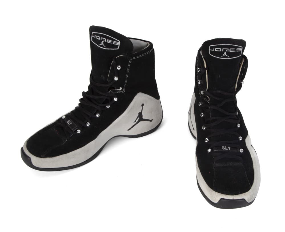 a pair of black and white jordan shoes on a white background