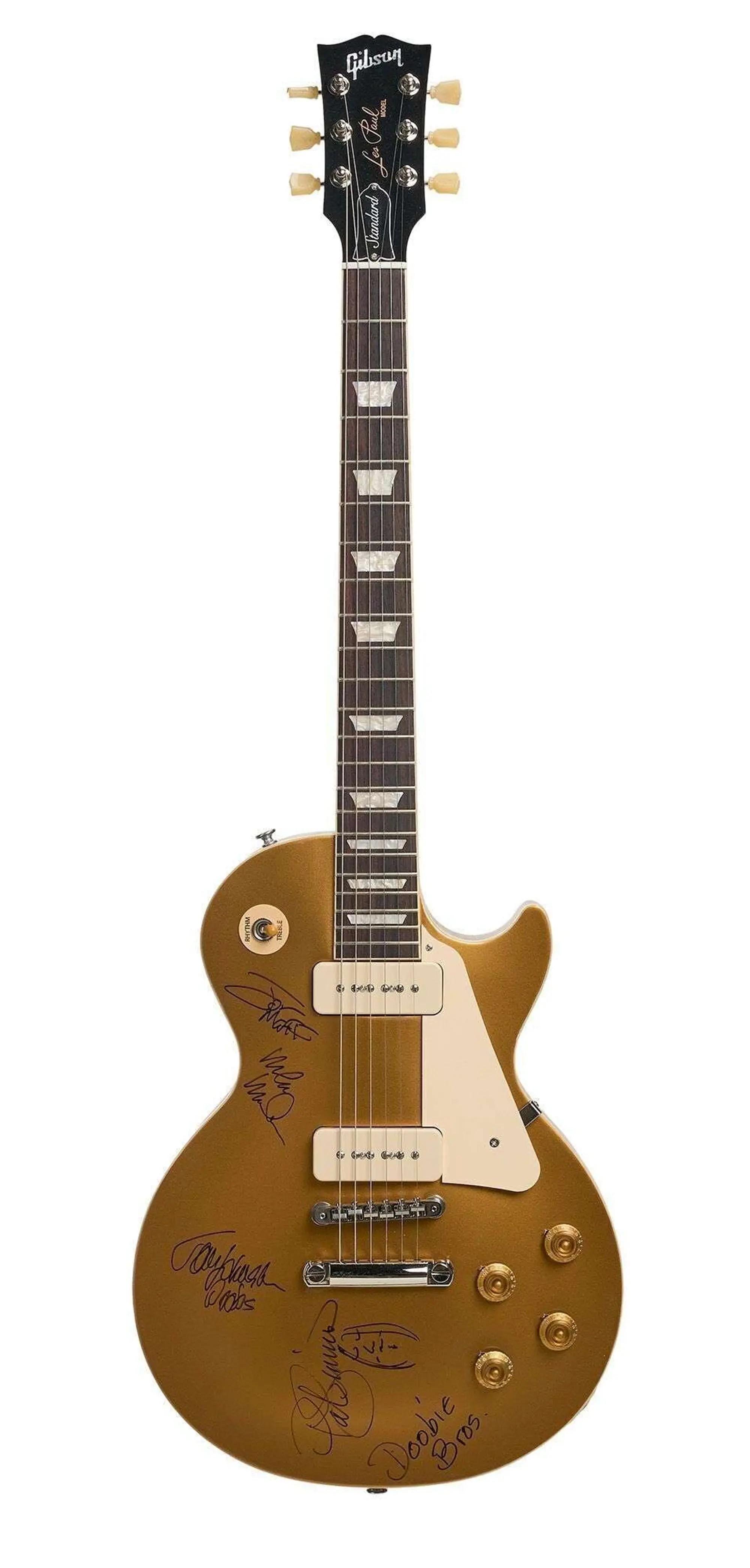 Lot #11. The Doobie Brothers | Band-Signed Gibson Les Paul Standard 50s P90 Electric Guitar Goldtop A gold Gibson Les Paul Standard electric guitar with multiple signatures on its body, against a white background.