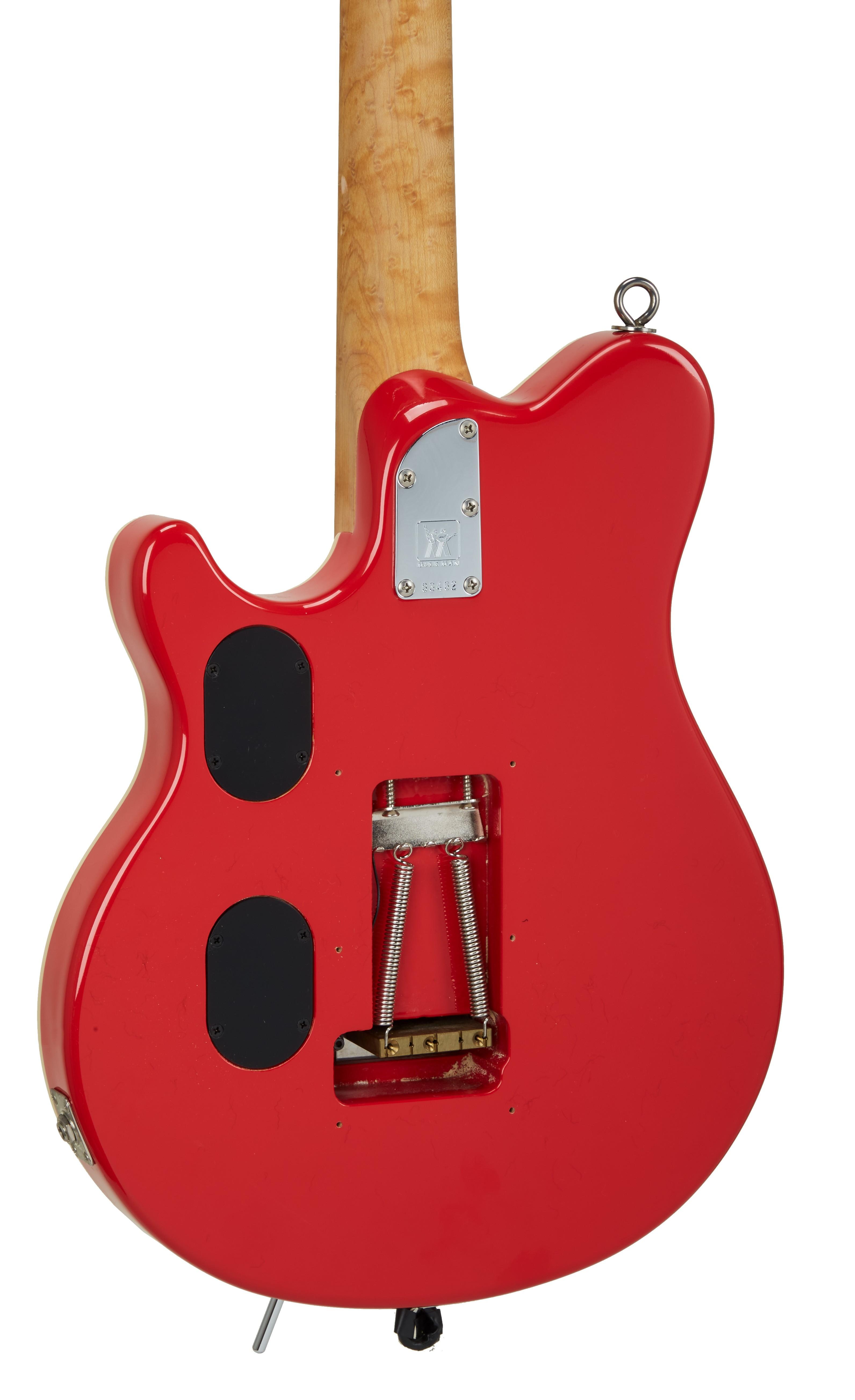the back of a red electric guitar with a sticker that says ' ibanez ' on it