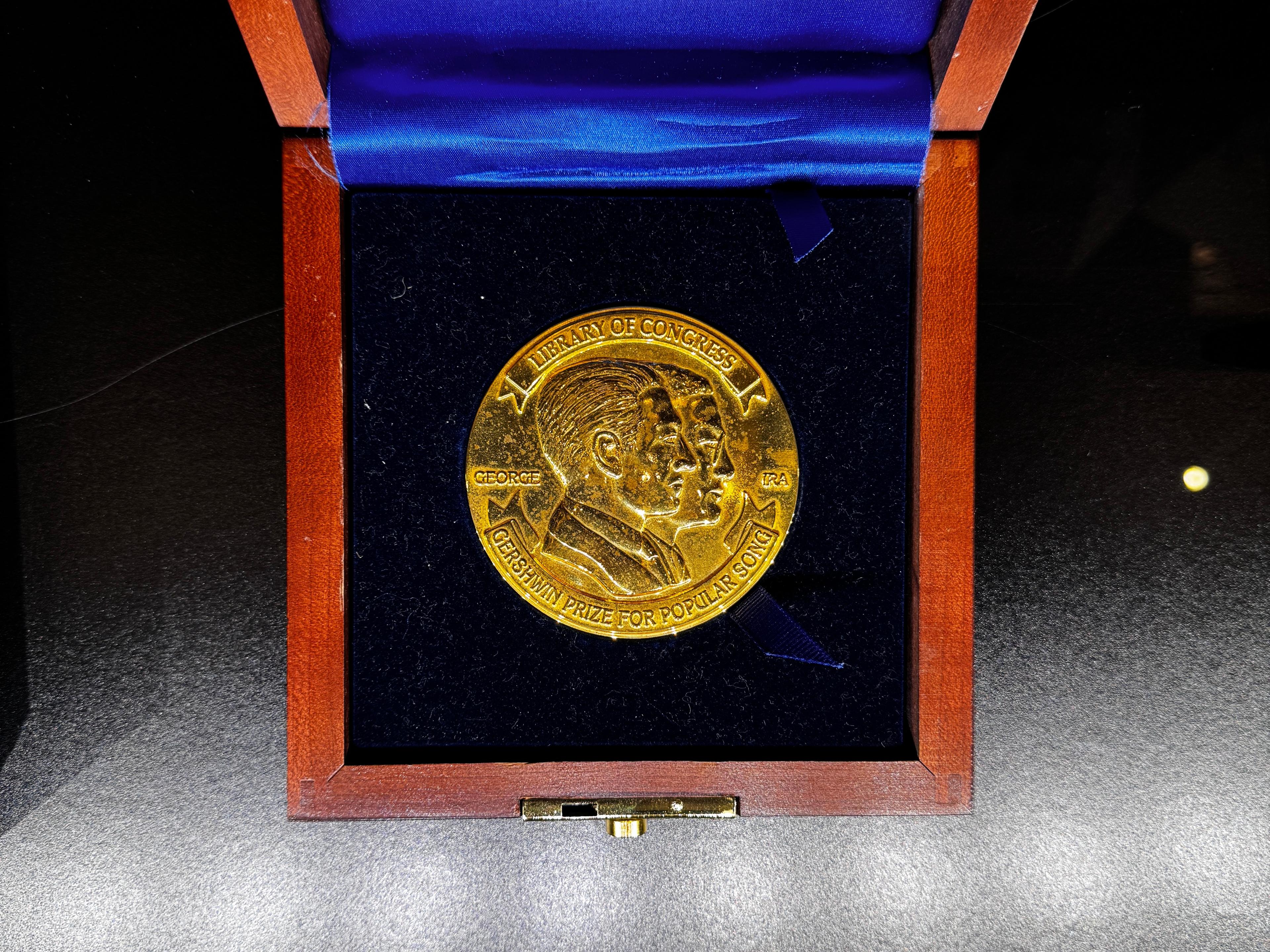 A medal in a presentation box