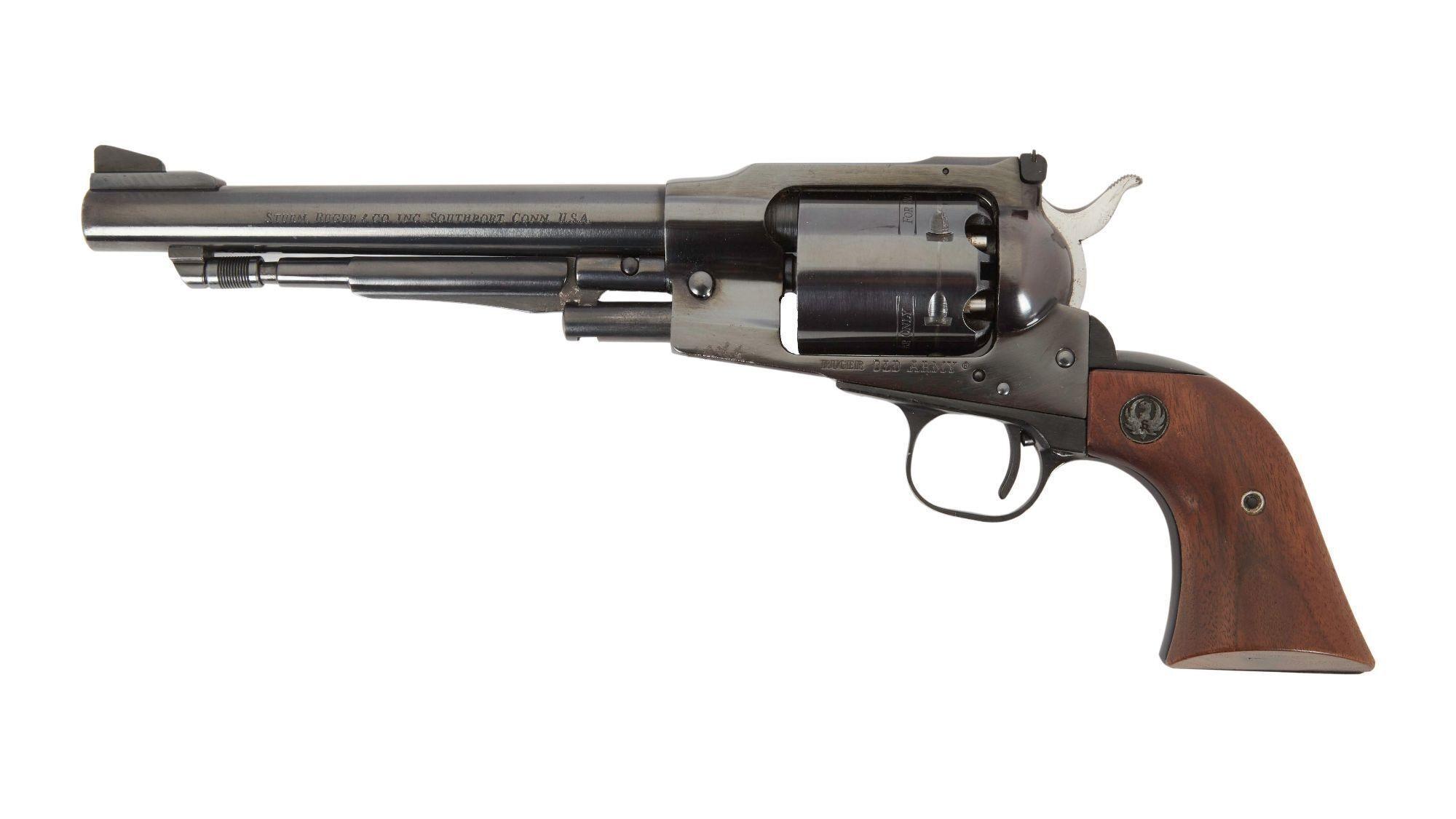 a revolver with a wooden grip on a white background .