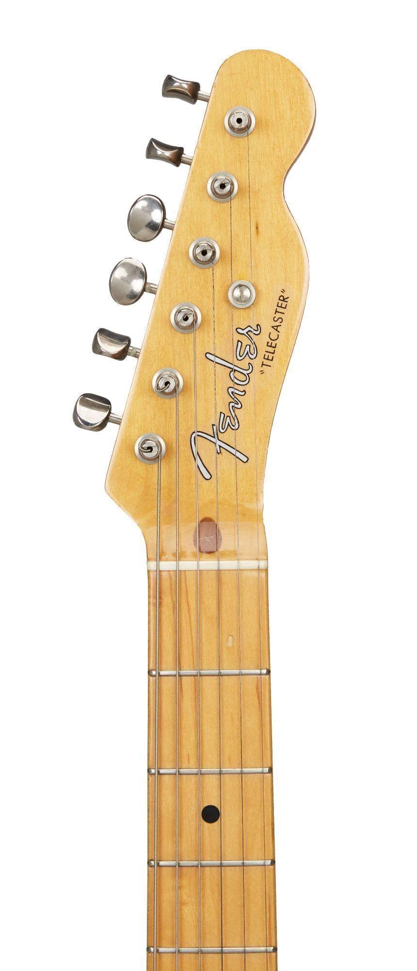 the headstock of a fender telecaster guitar