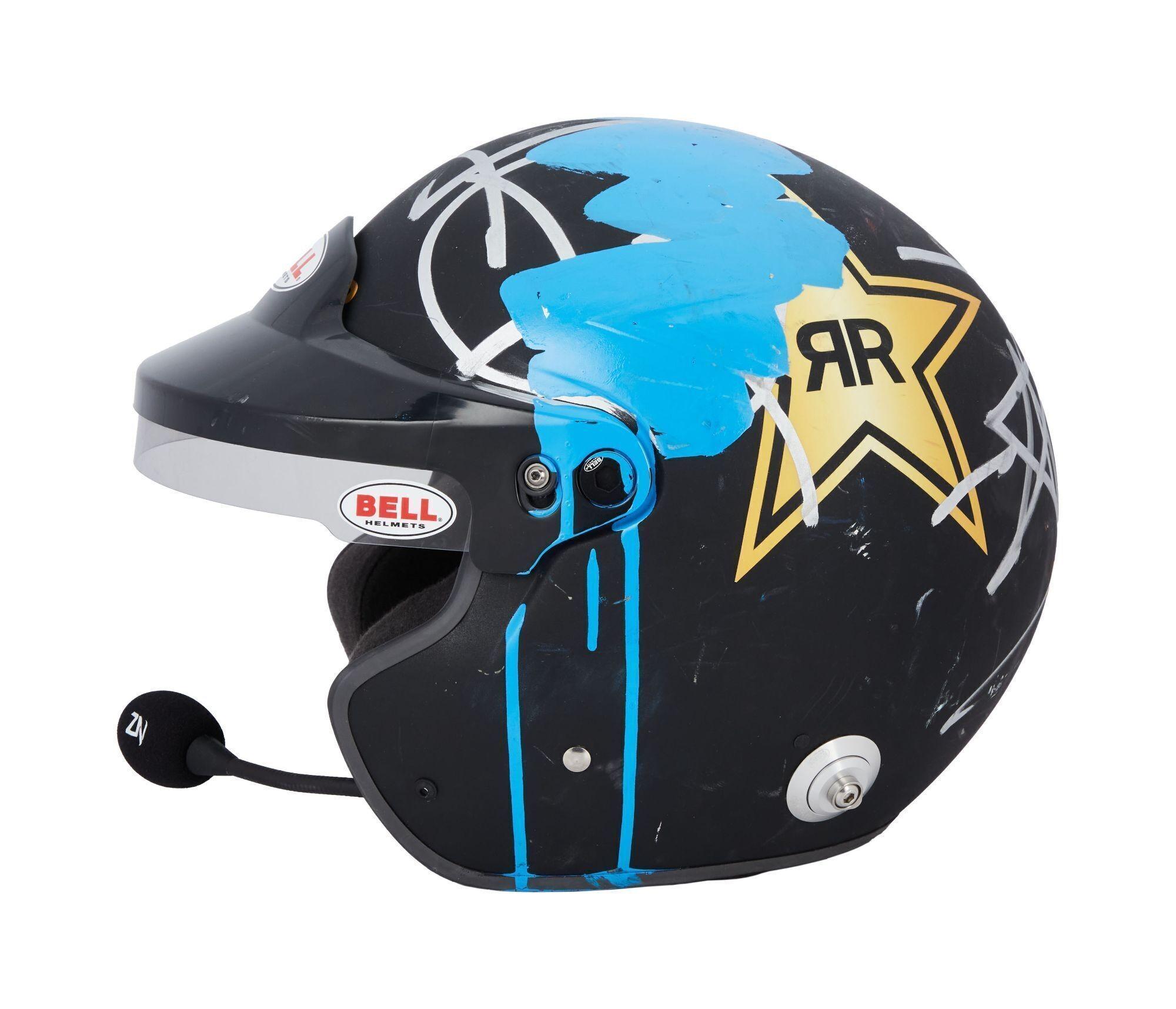 Lot #483. Angus Cloud | Photographed Doodled Rock Star Helmet a black motorcycle helmet with a microphone attached to it .