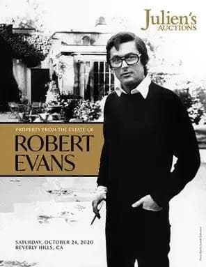 A black and white photo of Robert Evans for Julien's Auctions