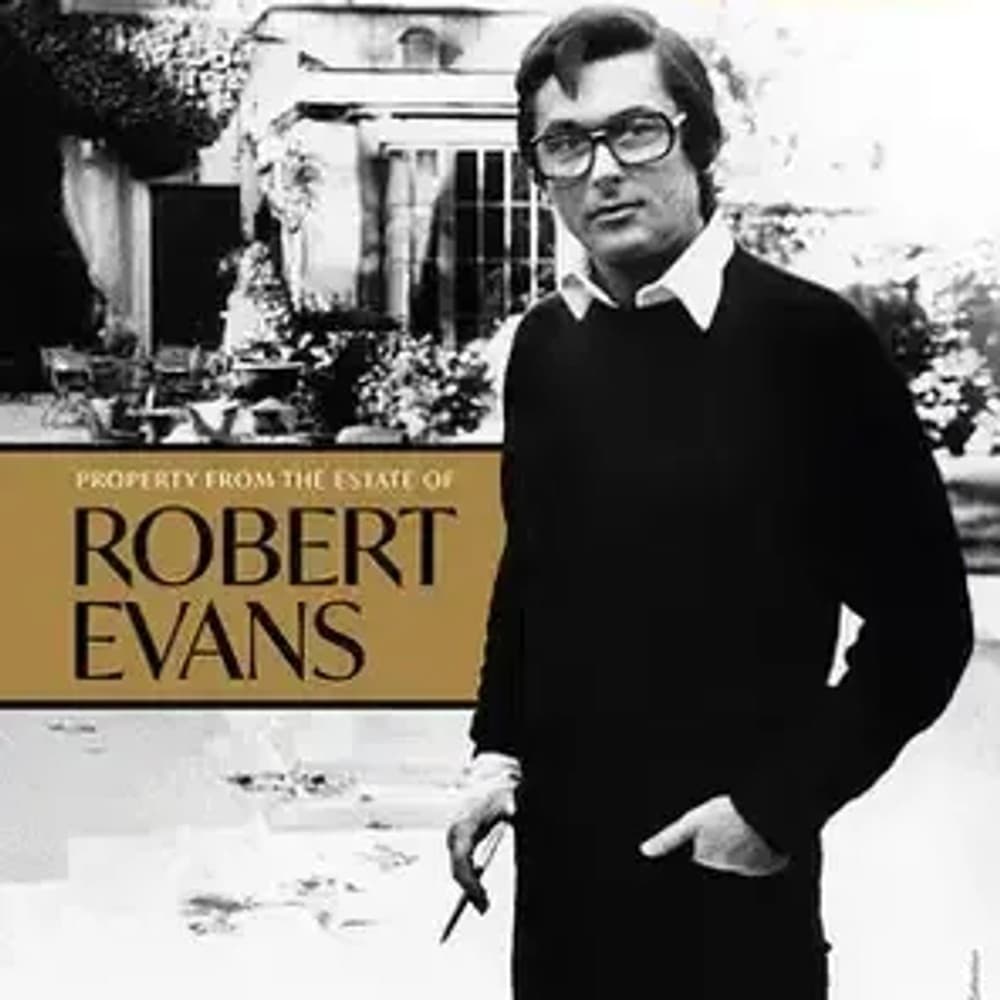 A black and white photo of Robert Evans for Julien's Auctions