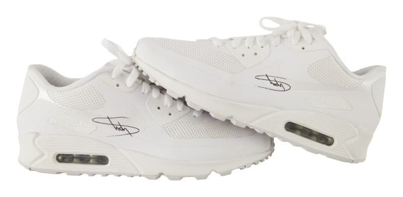 Two white Nike Air Max 90 sneakers, autographed by eminem.
