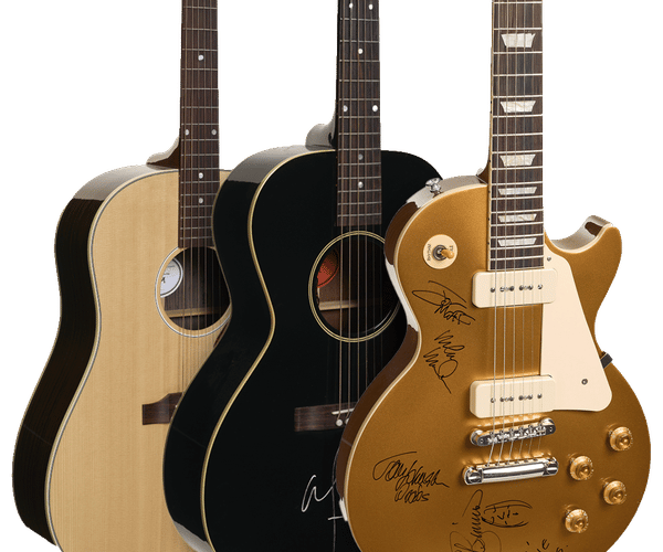 Three guitars: a light-colored acoustic, a black acoustic, and a gold electric guitar. The black and gold guitars are autographed.