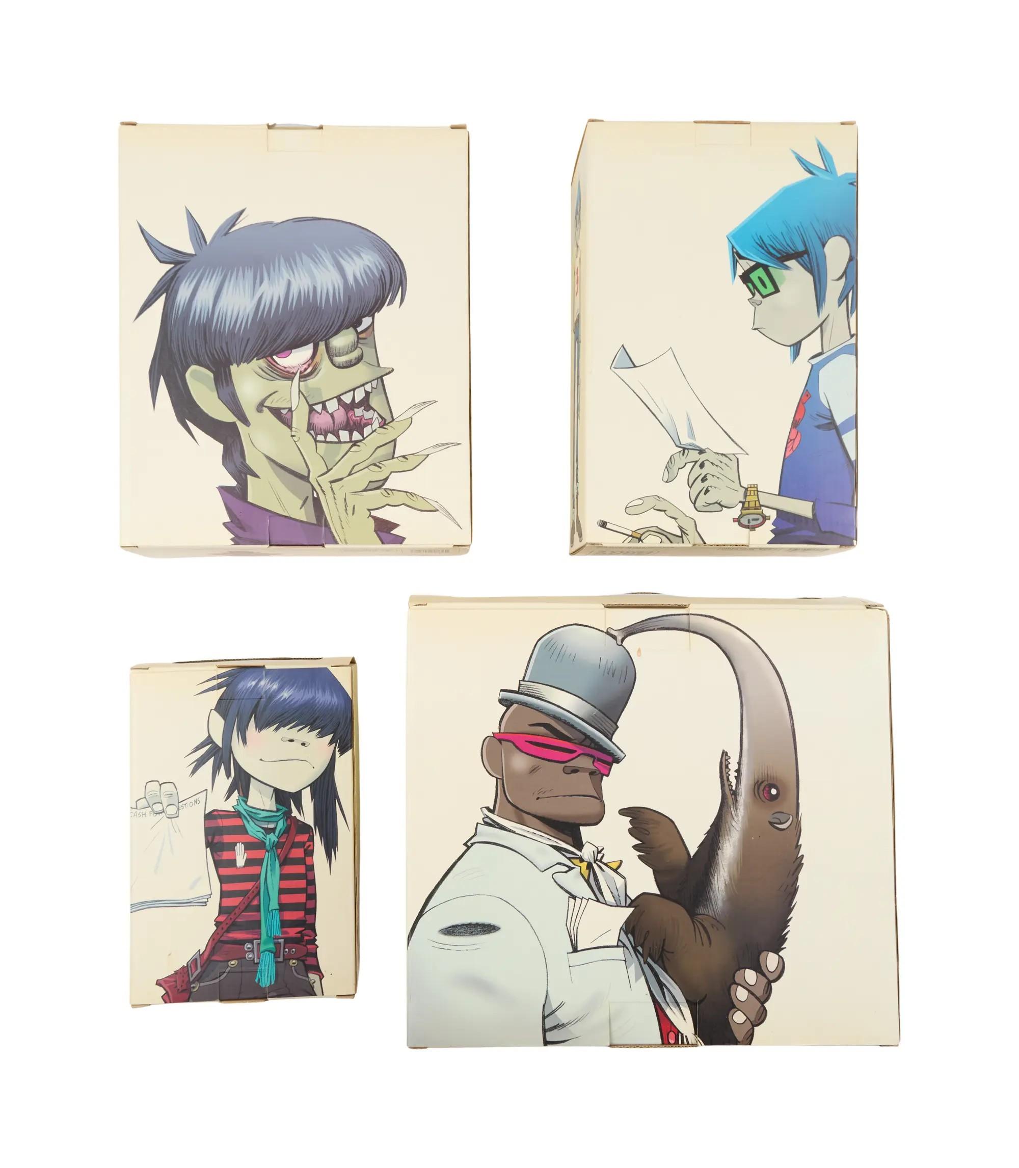 Four boxes featuring cartoon artwork of Gorillaz band members Murdoc, 2-D, Noodle, and Russel holding an anteater.