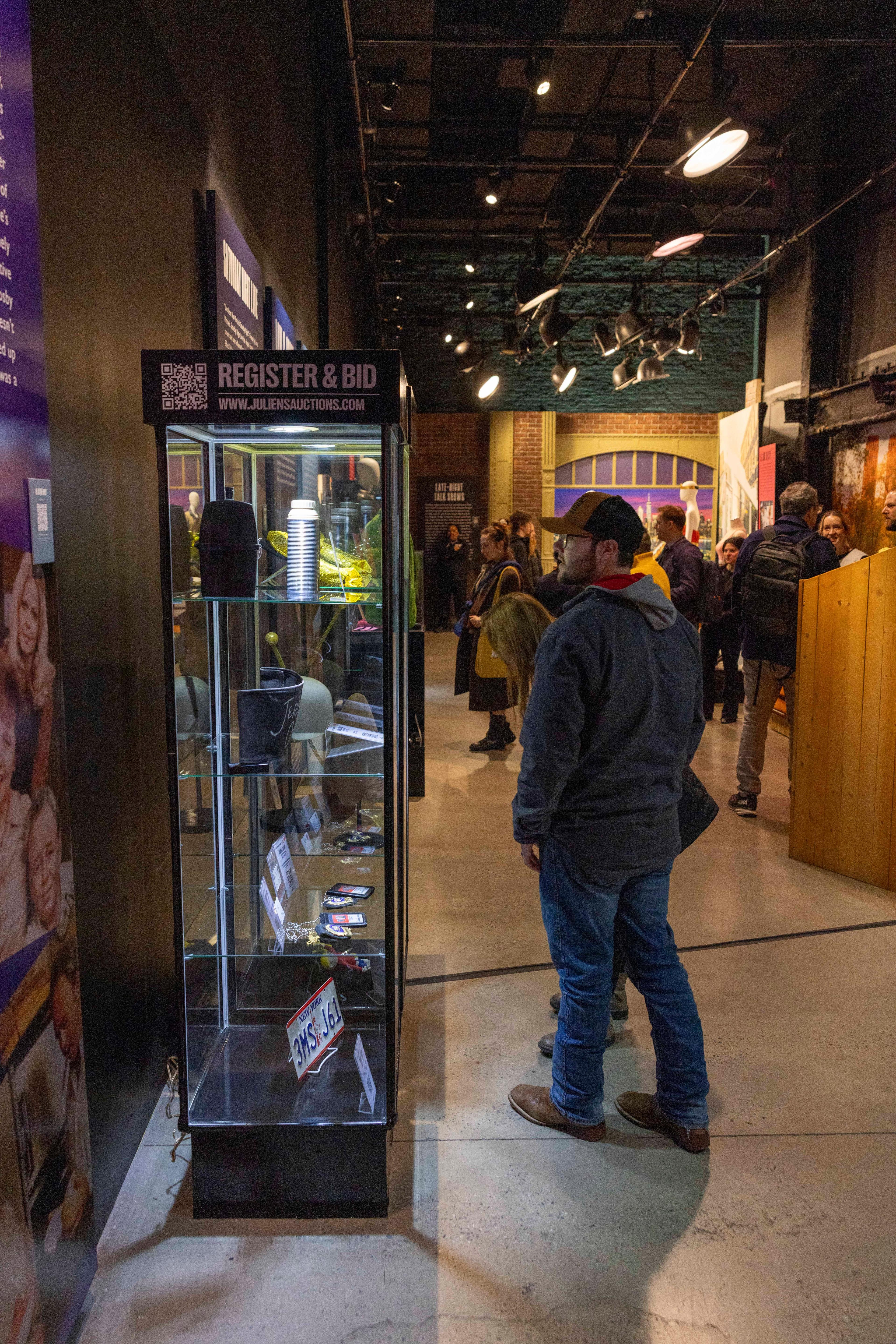 attendees visit a julien's auctions exhibition