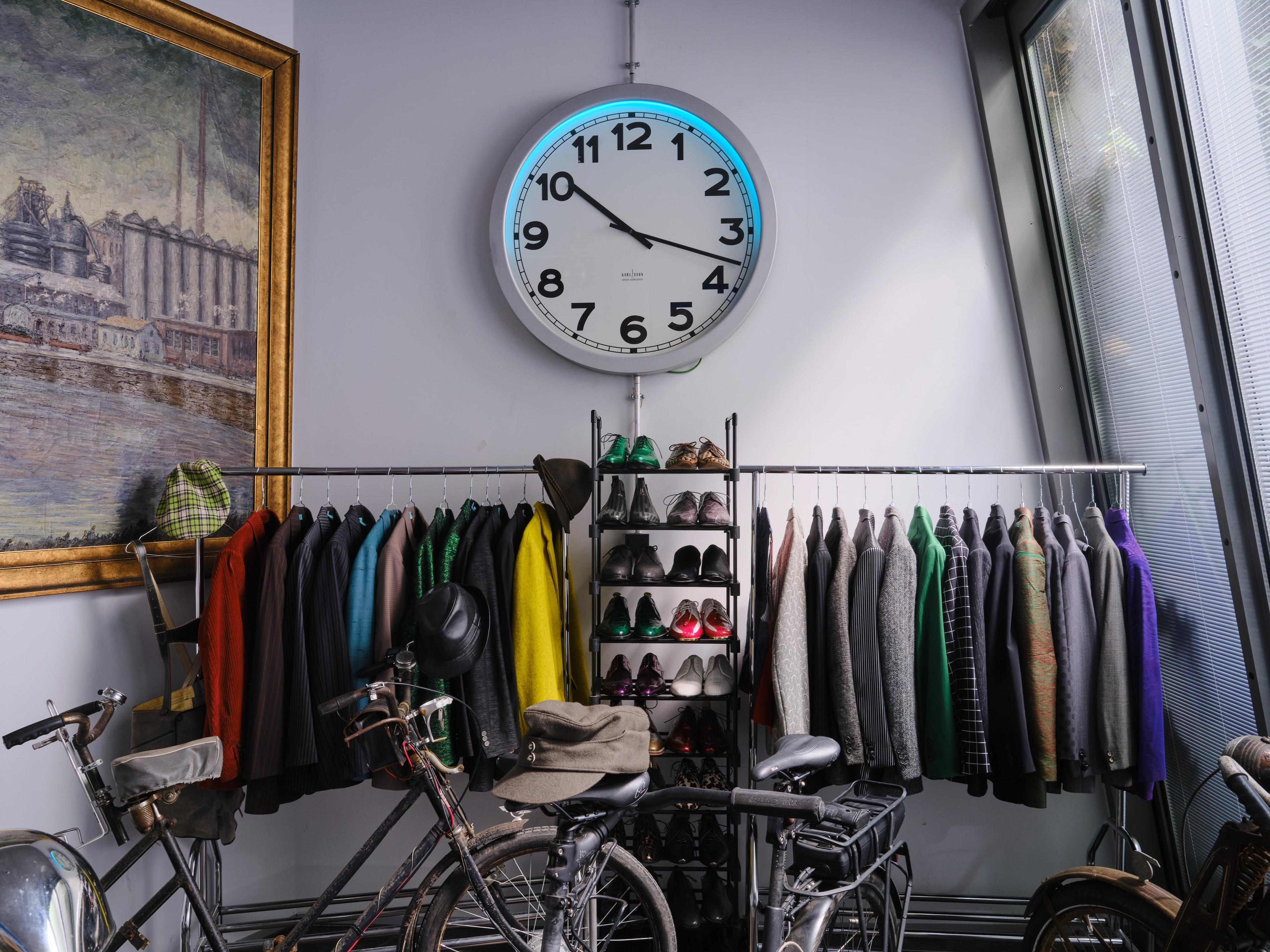 a picture a clock clothing and a crop of bikes from the collection of florian schneider