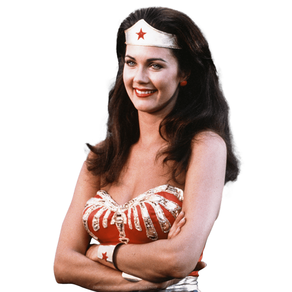 a woman in a wonder woman costume with her arms crossed