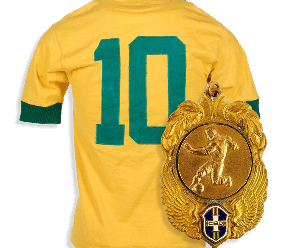 A gold FIFA medal with a female figure hangs beside a blue soccer jersey displaying "MBAPPÉ 7".