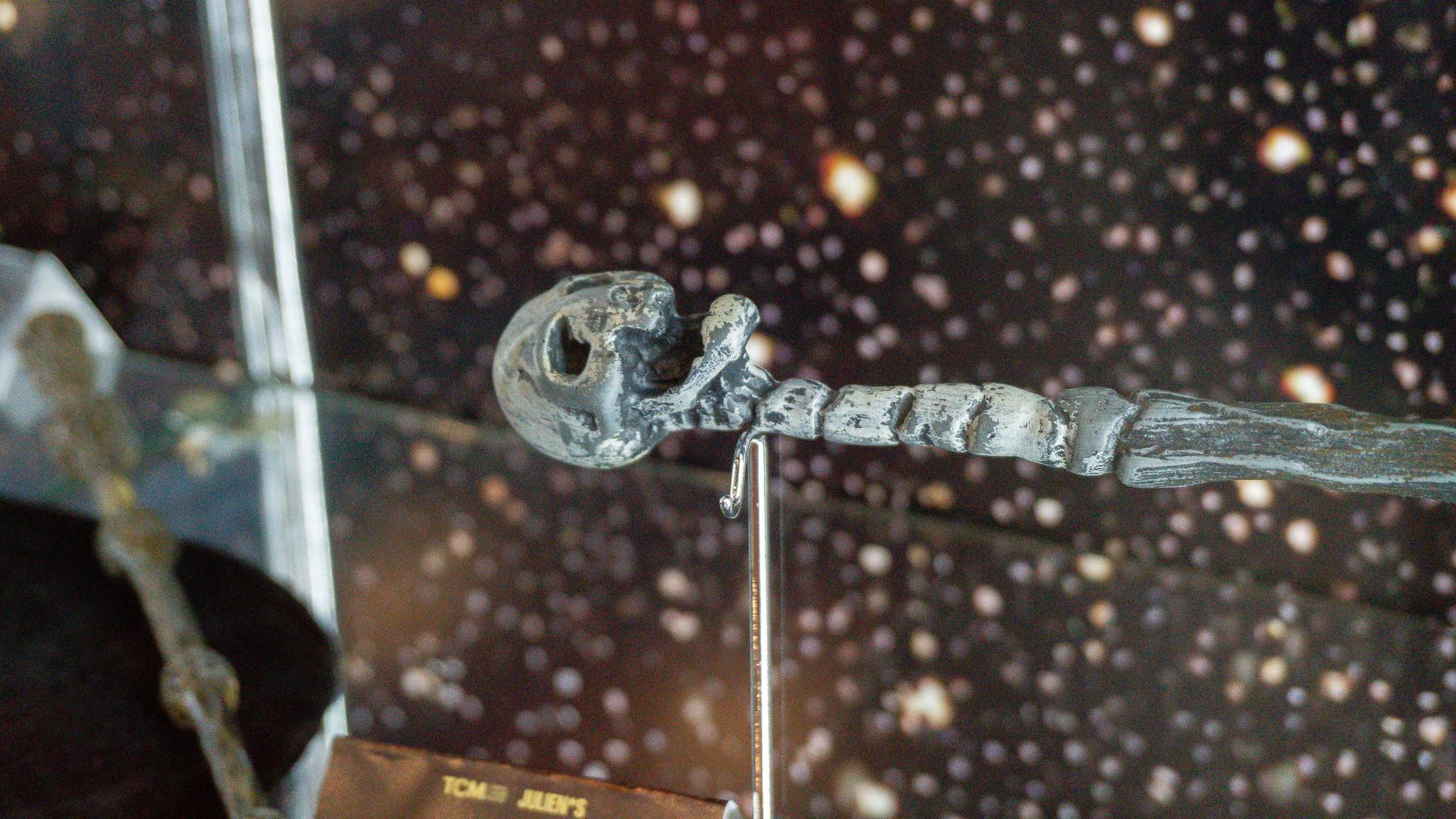 a close up of a wand on display in a glass case .