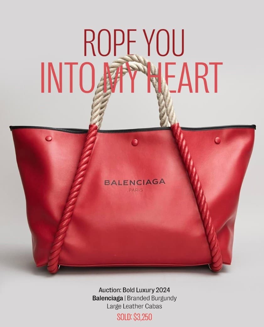 a red balenciaga bag with a rope handle