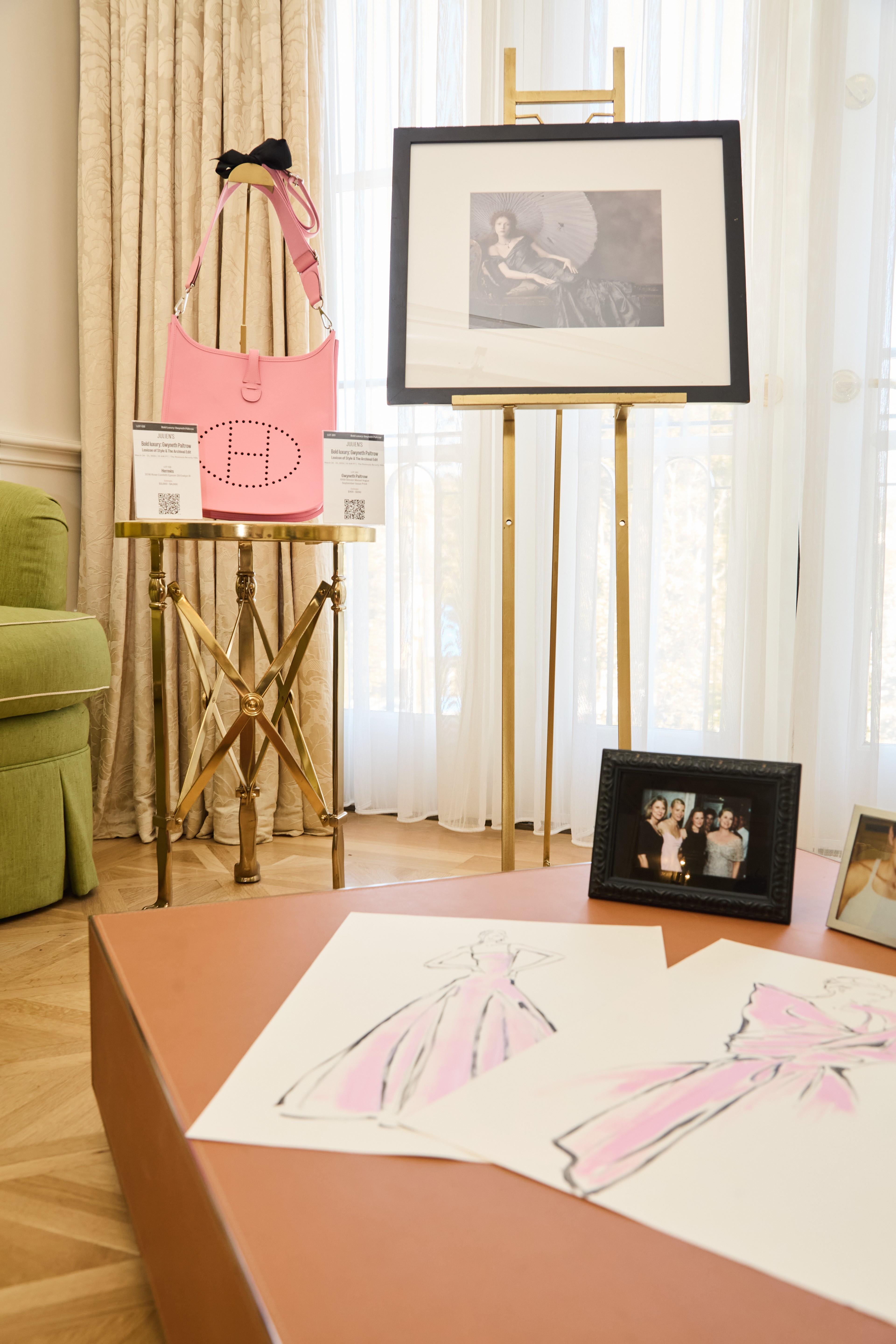 pink dress sketches on a coffee table from the personal collection of gwyneth paltrow