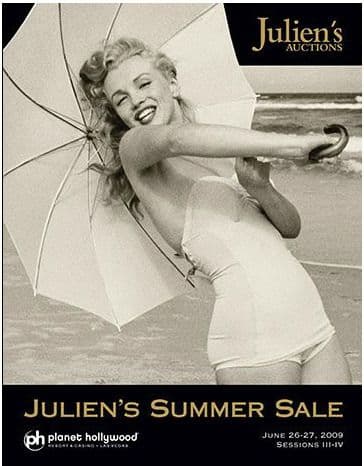 A black and white photo of Marilyn Monroe on a poster for Julien's Auctions